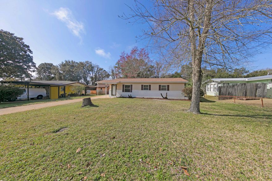 Looking for a turn-key first home or great investment property ? You've found it. Adorable, renovated, affordable home in great neighborhood! NEW Acadia Luxury Vinyl Plank flooring throughout & newly painted interior w/all NEW doors and trim provide a fresh, updated look. Beautiful NEW quartz counters on painted white cabinets take center stage In the eat-in kitchen. A new vanity, round mirror & light fixture accent the full bathroom. Other features include new light fixtures & fans, a laundry area, newer windows & newer exterior paint. The NEW ROOF provides affordable insurance and peace of mind. A large covered patio allows you to enjoy the Florida lifestyle & the huge fenced backyard provides plenty of space for play and/or a pool.  Easily store boat, RV & protect your vehicle under the