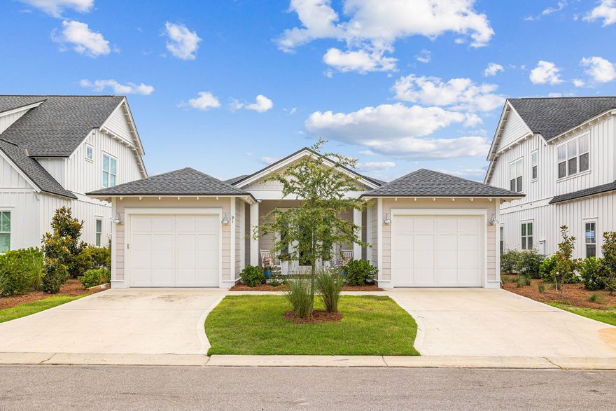 Welcome home to this immaculate, one-level 3BR/3BA Florida cottage with private swimming pool in the idyllic Watersound Origins community. Featuring the popular Eastport plan from Romair Homes, two separate one-car garages frame a covered porch at the home's entrance. Step inside to light-toned wood flooring, airy 10' ceilings, beautiful millwork, and a soothing neutral color palette throughout. The foyer leads to a spacious great room highlighted by custom built in shelving in the living area and a white beam above the gas fireplace. Effortlessly prepare and serve gourmet meals from the accommodating kitchen with a large island, quartz countertops, floor-to-ceiling cabinets, and professional grade stainless-steel appliances.