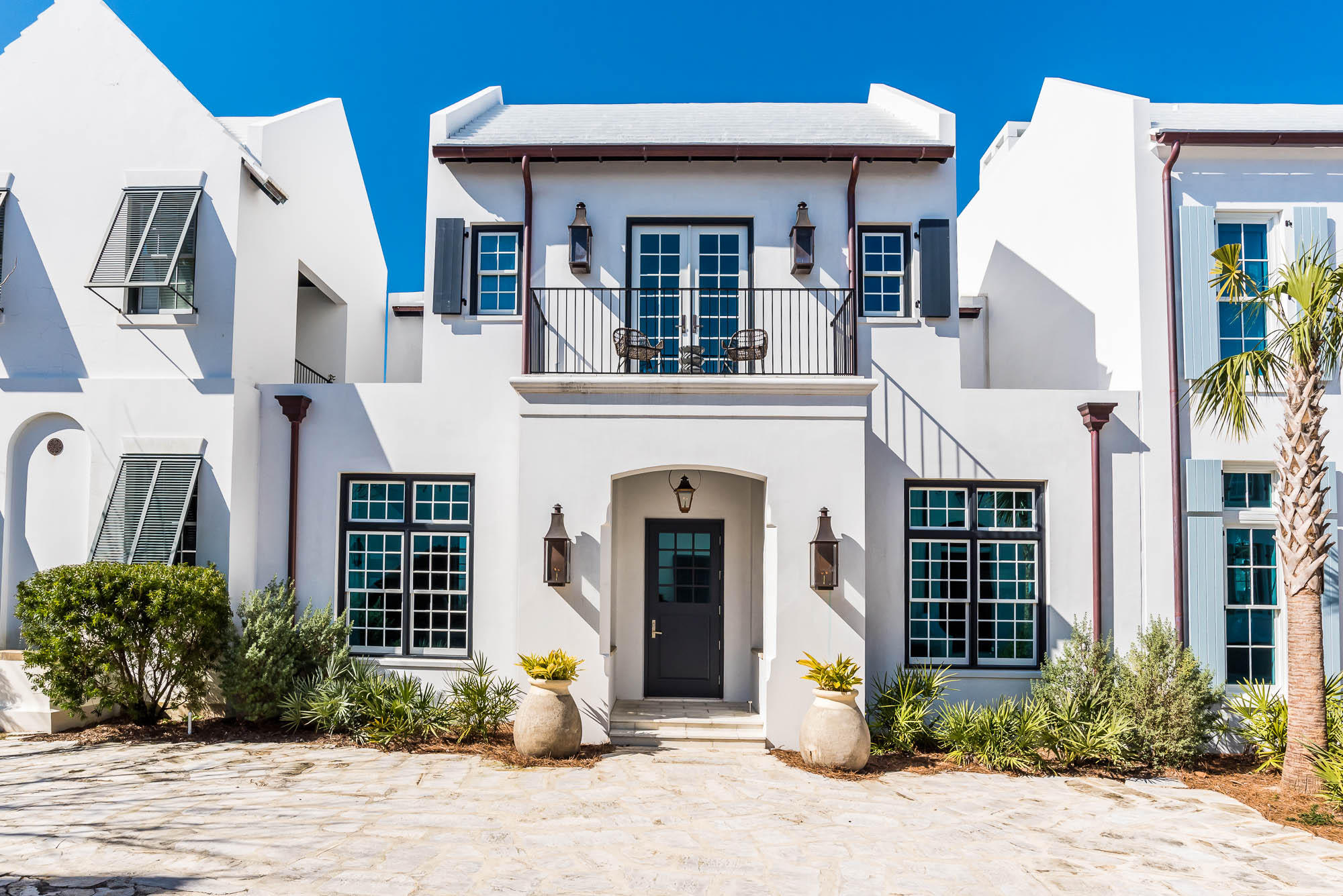 Vision and execution came together at 21 Lady Bug Court to create a 5 bedroom Alys Beach home that is set apart. Architectural design by William T. Baker gracefully defines the 4,596 square feet.A first-floor Master Bedroom looks out to a private courtyard oasis that is anchored by a Gunite pool spanning 38 feet. Natural light fills the 800 square foot great room which contrasts its venetian plastered walls with a dramatic wood ceiling. The gourmet kitchen includes a 48-inch Wolf Range, dual Sub-Zeros, dual Asko dishwashers, an ice maker, a custom venetian plastered hood and Walker Zanger porcelain slab countertops.A second-floor living area is set amongst 3 guest bedrooms and a second Master Bedroom that overlooks the iconic Sea Garden Pathway. A third-floor rooftop terrace hosts a