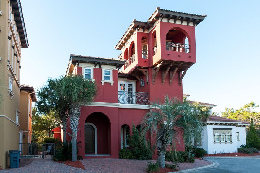An unobstructed view of the Gulf of Mexico can be enjoyed from the 3rd floor covered balcony of this Mediterranean-style villa, situated south of Scenic Highway 30A approximately 150 yards from beach access in Blue Mountain Beach. Its incredible location, spacious interiors, and private pool with hot tub have brought it success on the vacation rental market, and excellent revenue. Lofty ceilings accented by crown molding, as well as stylish stone floors carry throughout the open 1st floor living areas. The handsome kitchen features wraparound bar seating that stretches from the living room into the light-filled dining room with coffered ceiling. The master bedroom is conveniently located on the 1st floor and features direct access to stone paver pool deck.