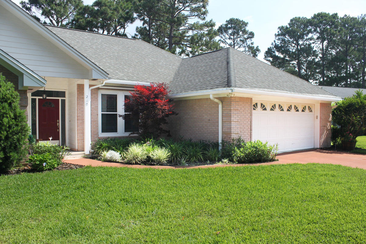 Exquisite Turn-Key property! Beautiful cul-de-sac Golf Course Lot with wood floors-PLUS 4 bedrooms-PLUS sun room- PLUS screened in porch! This home has it all! Privacy. Golf Course Views. Remodeled Kitchen. Gas Stove. Metal Storm Shutters and so much more. The kitchen boast new kitchen cabinets with soft closing doors & drawers, pull our drawers in every cabinet and custom enclosed pantry. Enjoy top of the line veined granite counter tops and decorator style back splash with unique ornament designs. Cooks dream kitchen with gas stove & spice drawer. Mom's dream kitchen with breakfast bar and eat-in area overlooking the manicured back yard. Sip sweet tea on your screened in porch. Wait until you see the generous master bedroom suite including fine details & granite counter tops.