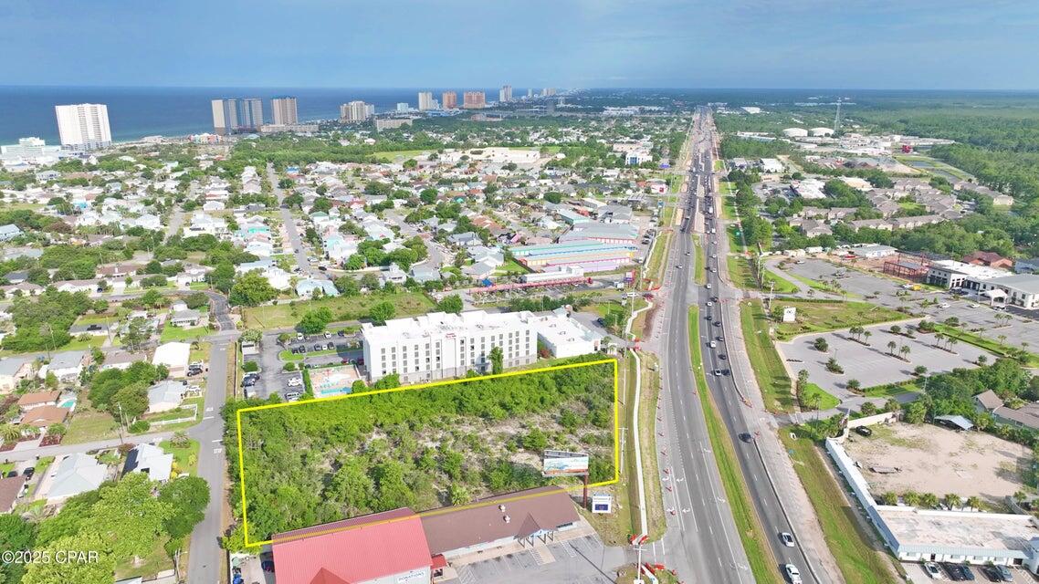 Prime 2.2-Acre Commercial Parcel on Panama City Beach Parkway. Unlock the potential of one of the most sought-after commercial locations in Panama City Beach. This 2.2-acre parcel sits directly on Panama City Beach Parkway (Back Beach Road), offering high visibility and excellent access with frontage on one of the area's busiest corridors. Strategically positioned just minutes from top attractions including Pier Park, Top Golf, and Dolly Parton's Stampede Dinner Theater, this location benefits from heavy year-round traffic and close proximity to the beach, shopping, dining, and entertainment. Zoned for commercial use, this site is ideal for a hotel, restaurant, retail center, or other high-demand development. With utilities available and zoning in place, this is a rare opportunity for developers and investors to secure a premier site in a booming coastal market.