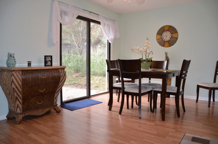 Perfect home at an amazing price within minutes to base and convenient to businesses. Well cared for and move in ready. This lovely home has had several rooms repainted and has been updated to include these features: new laminate wood flooring 12/2016 metal roof (2002), hot water heater (2012), newer refrigerator, cook top, wall oven and hood , ceiling fans added in 2006. A large utility room, adjacent to the dining room, with washer and dryer hook up has plenty of room for a folding table or additional storage. HUGE fenced in back yard with plenty of room for kids to play or to add a pool. Also has a large (10x15) storage building which conveys as is. Property has a sprinkler system in place. call today to schedule an appointment !! this one will not be on the market long at this price!