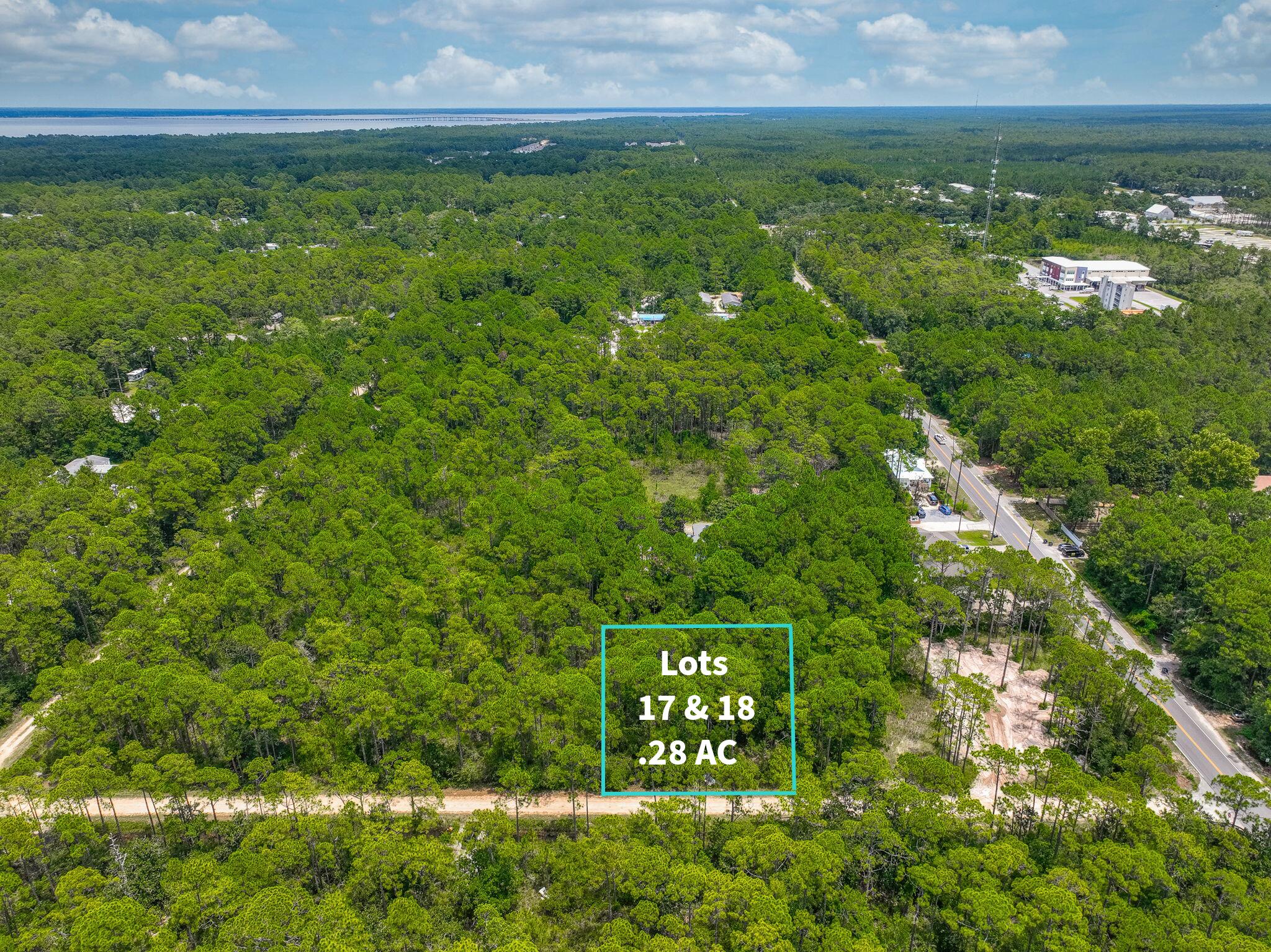 If you're looking for privacy, nature, and proximity to the water, this lot has it all. Tucked away just 2 miles north of Hwy 98, this .28-acre property offers a peaceful setting while still being conveniently close to everything Santa Rosa Beach has to offer. You're less than 4 miles from Ed Walline Beach Access and Topsail Hill Preserve State Park, and only about a mile from Cessna Landing, a county park on the bay with a boat launch, fishing, picnic areas, playground, and more. Plus, you're just minutes from grocery stores, restaurants, and local shops. Need more space? The neighborings lots (19 & 20) are also available, giving you the opportunity to own a combined half-acre to build your ideal coastal retreat. Contact us today for details!