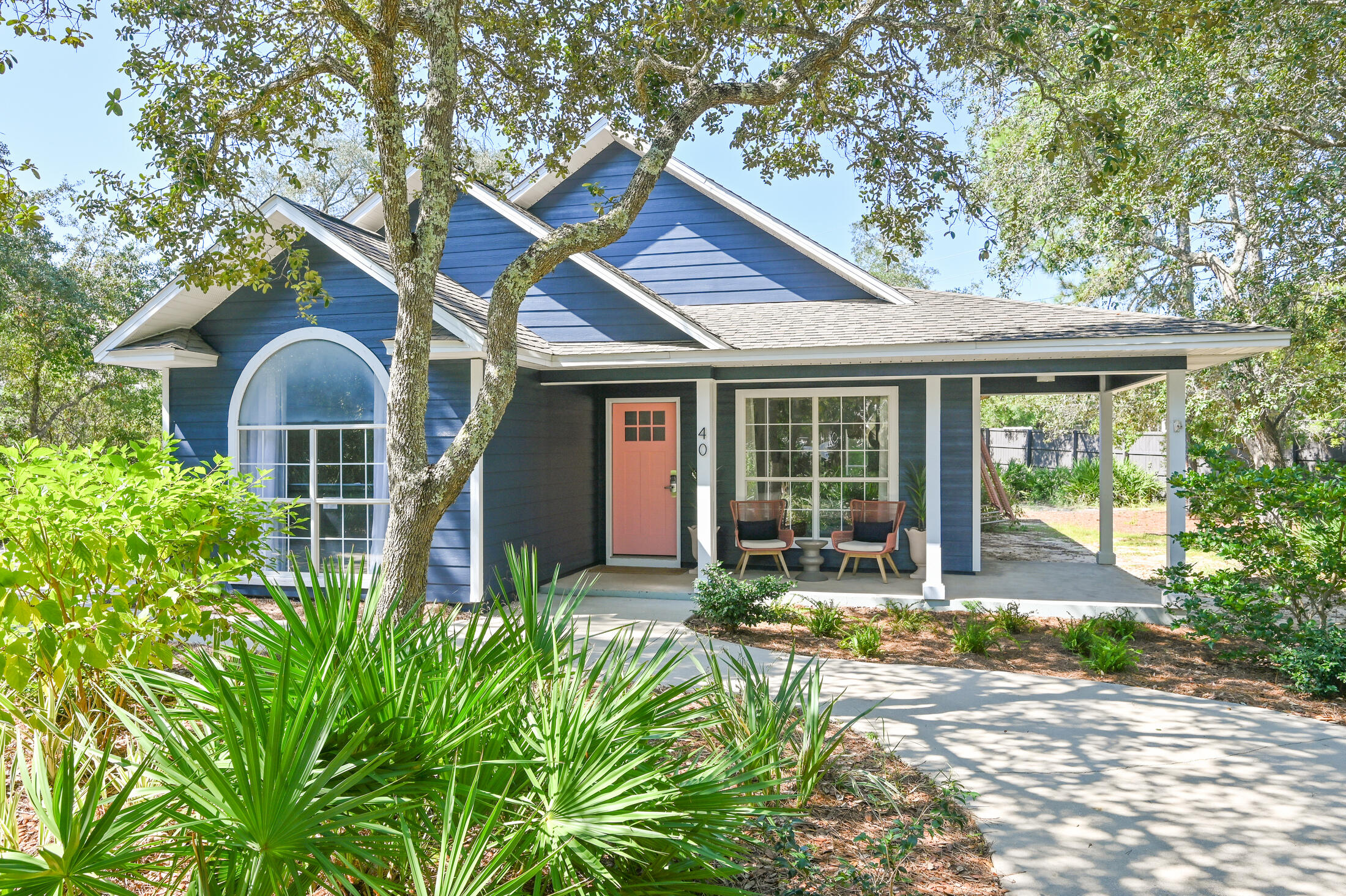 This Old-Florida-Style cottage is the epitome of a perfect beach getaway... Escape to the serene and private atmosphere of Seagrove Beach. The cottage is situated on one of the largest lots in Seagrove Village, offering plenty of room for expansion or addition of a guest house and a pool. The professionally designed three bedrooms and two bath home make it perfect for a single-family or a group of friends looking for their own space... it comes fully furnished and ready to use.The entire home has been updated giving the cottage a modern and beachy feel. The kitchen features granite countertops, white cabinets, wine rack, stainless steel appliances, and a beautiful tile backsplash, perfect for those who love to cook and entertain. The guest bathroom and master bathroom have also been