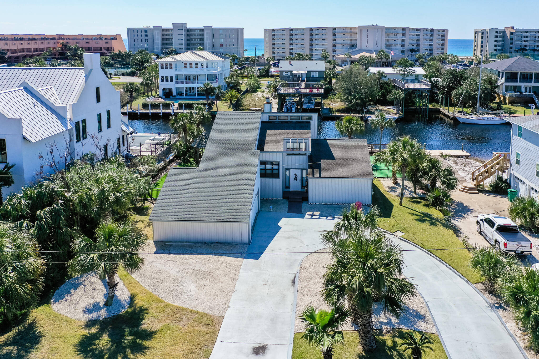 Fantastic waterfront opportunity on Holiday Isle in Destin FL. Located just steps from the crystal white sand beaches of Destin and direct waterfront with 90ft of lateral dock with a brand new boat lift this 3 bedroom 2 bathroom home is the best of both worlds. Homes on Holiday Isle in this price point rarely come available and will not last long.