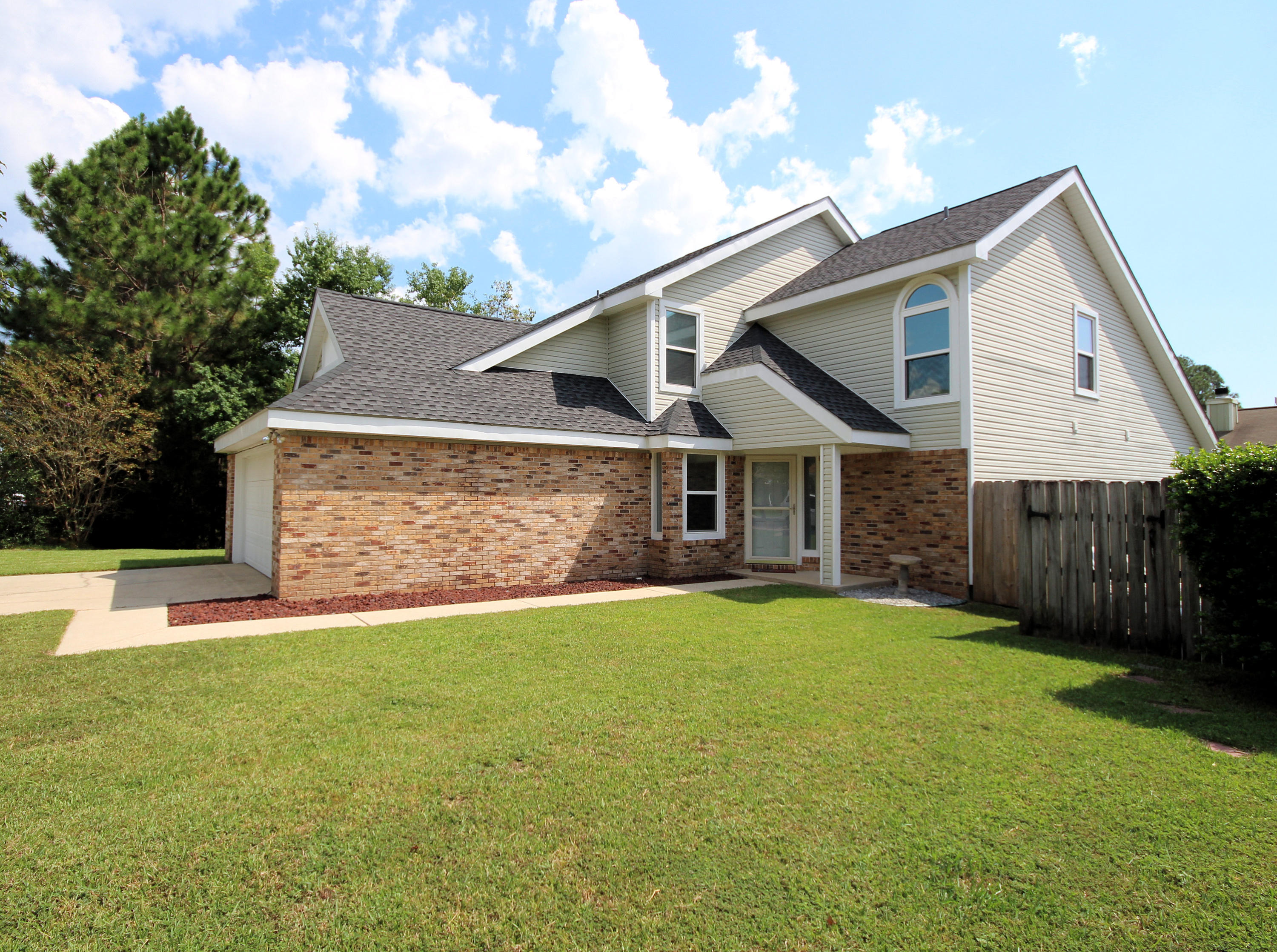 Move-in ready home, this 1,775 sq ft, 3 bedrooms,and 2.5 baths is centrally located in Fort Walton Beach. New ROOF Sept. 2014, new HVAC 2015!!Enter this home and notice the new interior painting, light fixtures, and cathedral ceilings. The living room is spacious and full of natural light, including a sliding glass door that goes to the outside patio. Perfect for grilling and entertaining with friends and family. Enter into the kitchen that features granite counter tops, new lighting, new stainless steal stove, new side by side refrigerator, new built in microwave, and dishwasher. A large laundry room is near the kitchen. In addition the first floor features the spacious master bedroom with walk in closet and sliding glass door that leads out to the patio Plenty of space in the master bathroom with a double vanity. Also downstairs features an updated half bath. Upstairs you will have two bedrooms and a spacious full bathroom. This home has been meticulously maintained with many improvements, including: New roof Sept. 2014, new HVAC 2015, new lighting throughout, new paint throughout, new exterior lights, new sink in half bath, and new faucets in all bathrooms! Don't miss out on this gorgeous home! Call today!