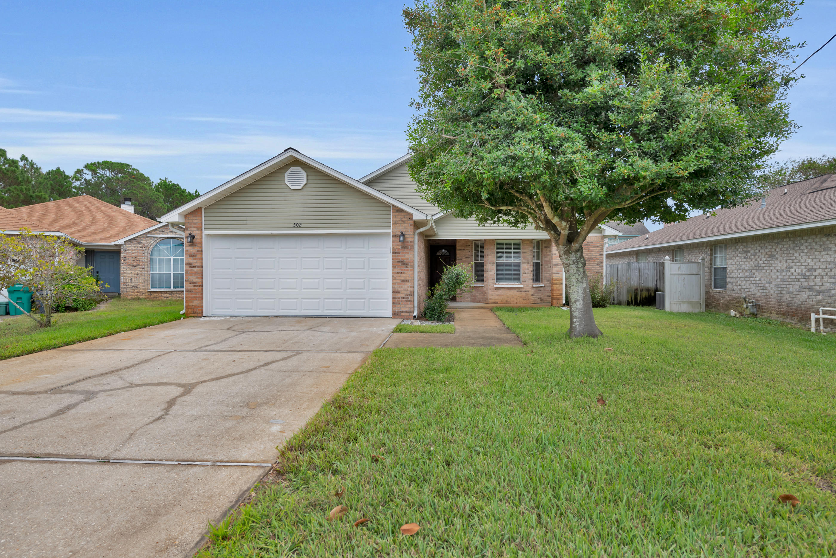 Well-kept home in the desirable Rush Park subdivision. Updated kitchen with stainless steel appliances and plenty of space to cook! The great room has room for everyone, with wonderful natural light. Split floor plan: toward the back of the home is the generous master bedroom and en suite. The hallway toward the front of the home leads to a full bath and the two guest rooms. Laminate flooring in living room, tile in wet areas, and all carpeting in the home was installed this year. Garage door is new and hurricane rated to 160mph. Home also features entry doors that open OUTWARD for added storm protection, custom by builder. Privacy fenced backyard. One year home warranty for buyer's peace of mind. Be in your new home by the holidays!