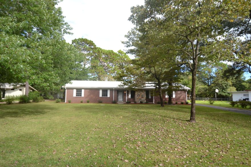 Great opportunity to own in the desirable community of Poquito Bayou! All brick home on huge lot with beautiful oak trees and landscaping located directly across from the bayou. Screened in back porch with plenty of room for a pool! New carpet in all the bedrooms. This home has tons of potential. Very close proximity to the community boat launch as well as Hurlburt Feild & Eglin Air Force Base.