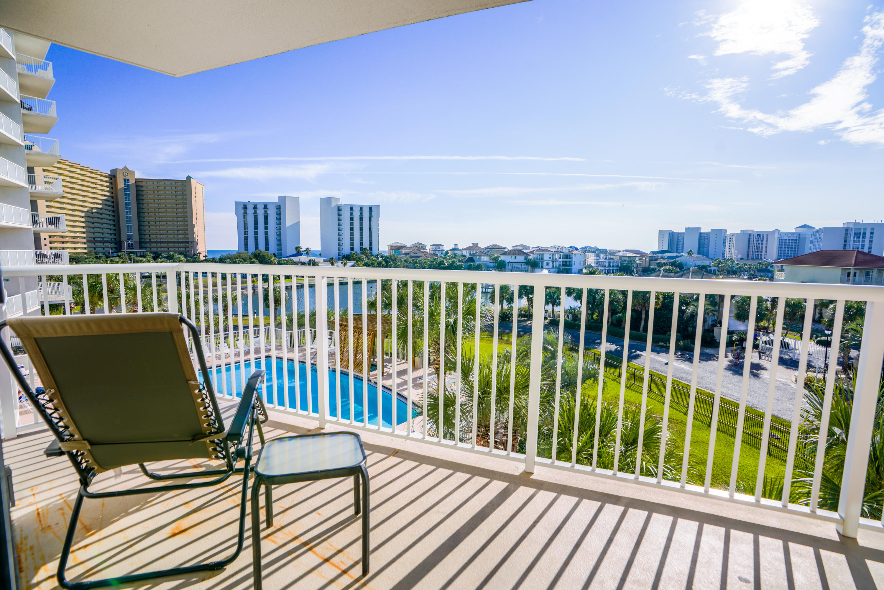 MAKEOVER ON THE GULF! Talking about a makeover this condo has been completely refurbished by a professional decorator in the last few weeks! All new furniture, paint, carpet, art, linens, & custom draperies it is a knock out coastal delight! Relax on the balcony while viewing the gulf, lake, & pool. This spacious two bedroom, two bath unit boasts an updated kitchen with pretty granite, neutral wood cabinets, & a breakfast bar with colorful new bar stools. The living area & the master bath have access to the balcony. The floors in the main area are all tile. Other features include a stackable washer & dryer, a pantry, & an owner's closet. Located in one of the most popular vacation complexes along the Emerald Coast, Pelican Beach is a guard-gated resort with amenities galore.