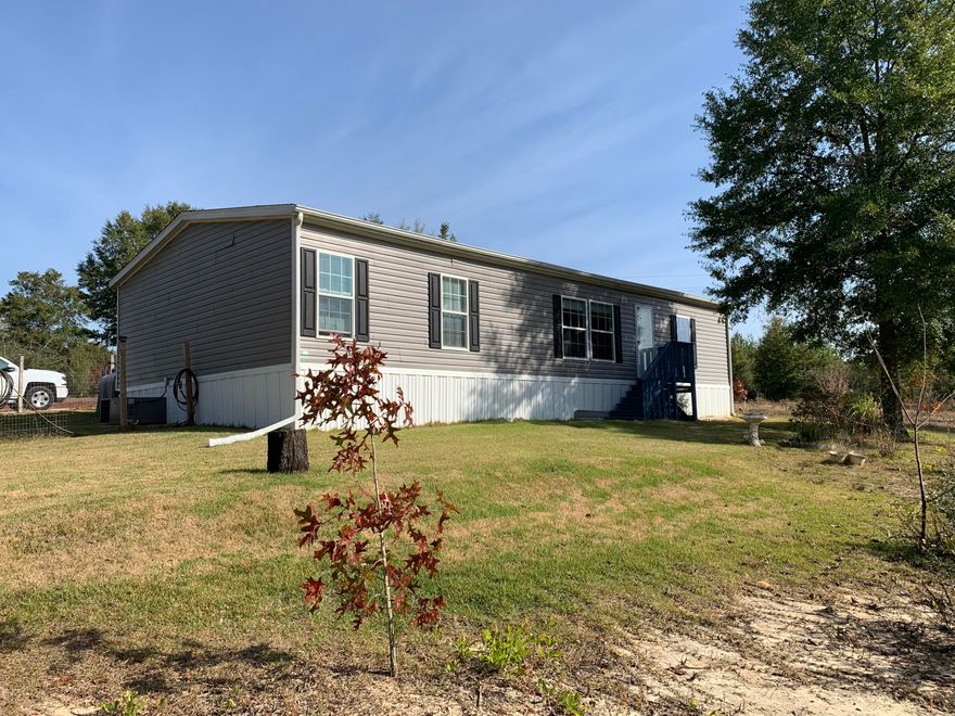 Don't miss out on this very nice 2017 3BR 2BA 1352 sqft double Wide Mobile Home located on over 2 acres of land just off of Hwy 90 approximately 10 miles from Crestview. This listing is made up of 3 parcels of land together that are approximately 2.19 acres total. Home has split bedroom plan, Nice size kitchen with oversized island, and large living room. Master bath has a double sink vanity, garden tub and separate shower. Property has a storage building with a covered parking area.