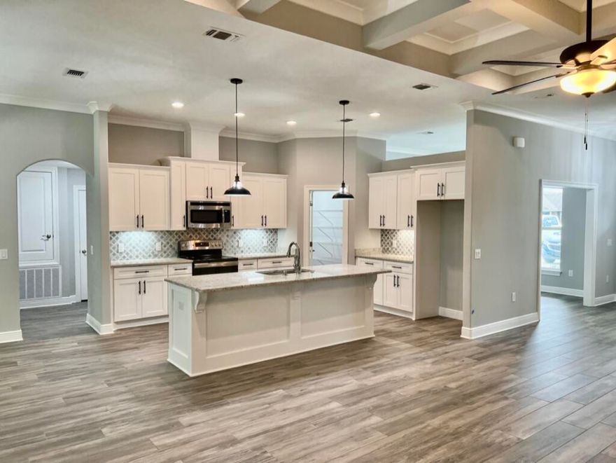 NEW Custom Built Home in Holley By The Sea,Enjoying all the Club House amenities including :Pools,Fully Equipped Gym,Tennis Courts,Waterfront Park & Deeded Access to Santa Rosa Sound .This luxurious 4 bed/3 bath tri split floor plan is nearly complete. ~Desirable Location within HBTS..with easy access to Navarre Beach, shopping and Hwy 98 to Hurlburt Field AFB.This stunning Robbins Builders Custom Home~offers trend setting design & features~Greeted by a walk in foyer open to the formal dining and office with double glass doors/sweeping through to your open floor plan ~Large gourmet kitchen enjoying shaker cabinets with crown molding beautiful granite counter tops~Tiled Back splash~ Under mount sink~S/S appliances~large walk in pantry ~center island with open flow to the breakfast nook and family room, wood plank staggered tile through the foyer, dining room, main living area, laundry and bathrooms. Large Master with trey ceiling & ceiling fan. Master bath offers a large tiled walk in shower /separate soaking tub~Granite double vanity with picture frame mirrors & huge walk in closet.Two additional bedrooms are a great size with ~ ceiling fans and Jack & Jill bathroom ~ step in tub/shower & WC with separate closet /vanity areas.Third additional bedroom is separate from the other rooms and would make a perfect guest/teen suite with its own bathroom and access out to the large covered porch.Laundry room & over sized 3 car garage ...ideal for the larger trucks and still plenty of room for all the outdoor toys. Home is situated on a large lot with grassed yard ~sprinkler system~ lawn pump and well with digital programmable timer for easy care. TAEXX in wall pest control system~ Fabric Shield Hurricane protection and dimensional shingle roof for lower insurance premium. Upgrades include crown molding, recessed lighting ,framed mirrors, deluxe lighting package,50 Gallon water heater, garage door remotes, attic drop down stairs~ to name a few......Call today for further information ,colors and construction status.** pictures are of a previously closed home so colors ,fixtures & finishes may vary .