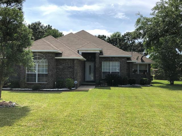 Welcome to this Brick Home in popular Holley By The Sea. Spacious floor plan with 3 bedrooms, 2 baths and 2 CAR GARAGE. **Large LIVING ROOM with corner Fireplace, new LVT Flooring, Florida Room, Dining Room, Kitchen includes Stainless Appliances. The MASTER Bedroom is large with double closets. Master Bath features double vanity, Whirlpool Tub, and Separate Shower. Take a peak outside and you will find a Large Fenced YARD with Sprinkler System & Pump. A/C & Water Heater under 5 yrs old. Centrally located to shopping, dining, and to the beautiful white sandy Navarre Beach! Close to Gulf Breeze and Pensacola making this a great place to call home.