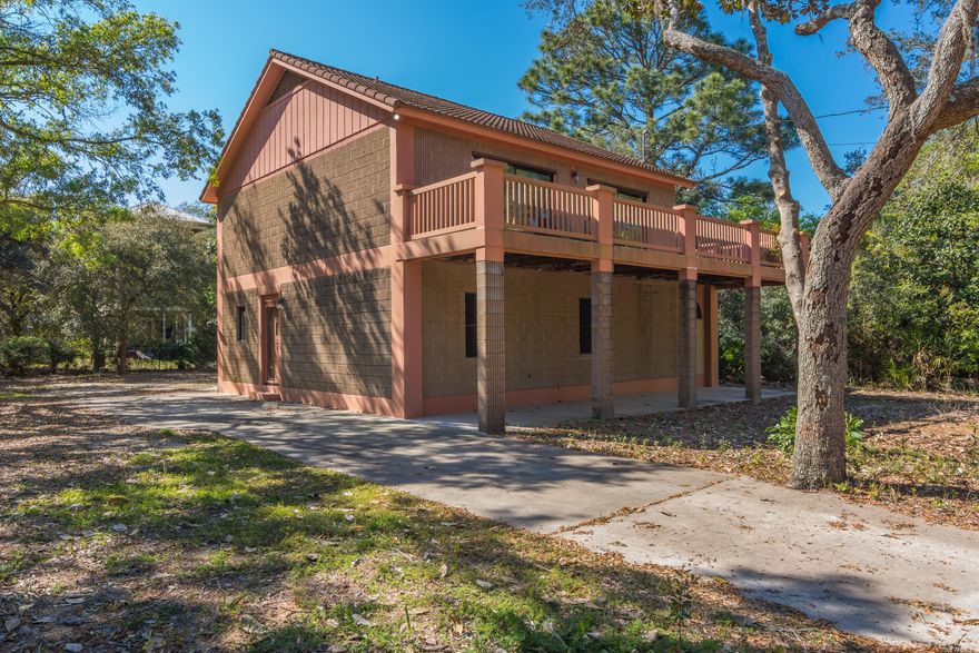 Welcome to Florida vacation living at it's finest! Beautiful views of Mack Bayou from this secluded location! Enjoy coffee while watching the sun rise from your second floor deck and bask in the peace and quiet. Wander inside to the large living area through one of the over sized glass sliders that brings plenty of light into the main room and fall in love with the open floor plan, wood flooring, and vaulted ceilings. Continue your Bayou views while playing a game of pool from the full-size pool table that is conveying with the home or relax and unwind with a glass of wine from the separate bar space upstairs. Fully stocked kitchen, complete with island, plenty of cabinets, tile counters, full size fridge, dishwasher and stove for all your entertaining needs.