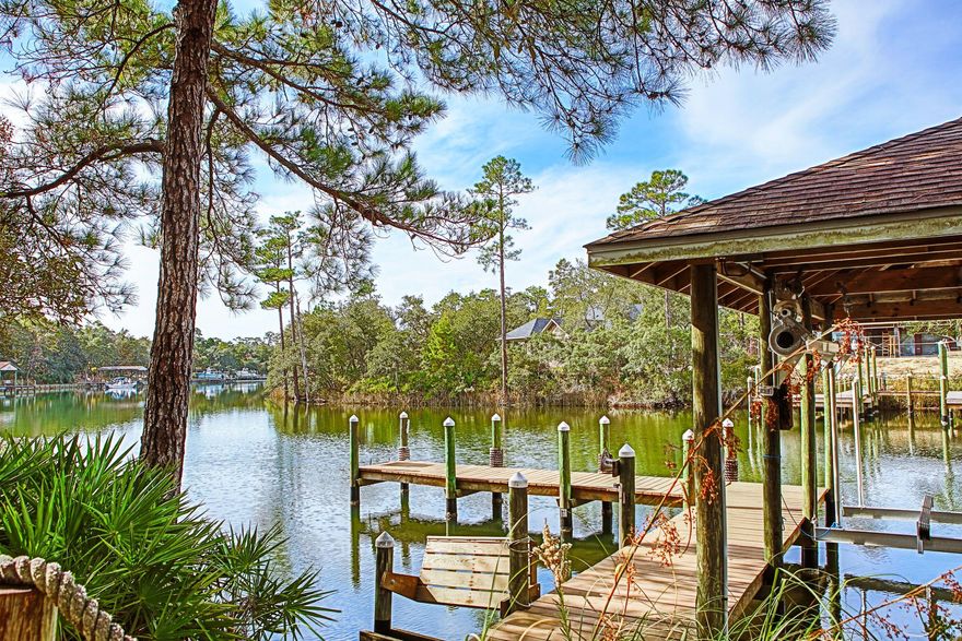 Deepwater on Shirk's Bayou. 196' across the bayou of waterfront views. High and dry lot with no flood insurance required. Custom built home by Joel Barton. Looking to keep your sailboat, fishing boat, or fun boat it isn't a problem with docking for 2 or 3 boats. The dock includes a boat house with additional docking slips with water and electricity. Like to paddle board or kayak not a problem as it has easy access built-in to make the transition smooth and easy. This all brick and stucco home is built with 2x6 construction. The water view can been seen from most rooms. The 20' soaring ceiling in the family room provides lots of natural light. The kitchen cabinets are solid oak that include pull out spice rack and more. The solid surface counters make for easy clean up.