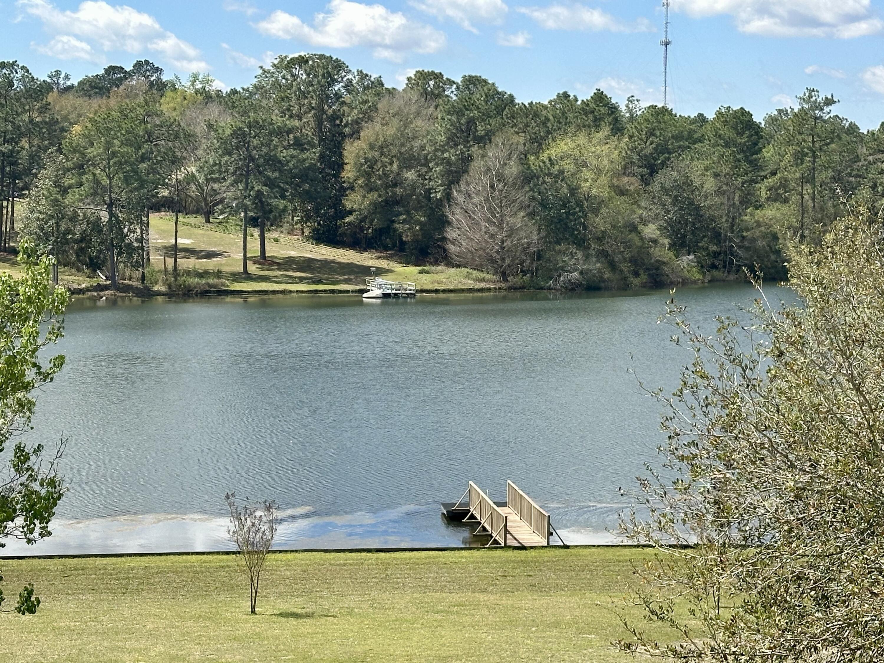 UNDER CONTRACT ACCEPTING BACKUP OFFERS. LAKEFRONT! 1.13 Acre PARK LIKE lot with seawall and 150 ft on the WIDEST PART OF THE FULLY STOCKED LAKE! The orientation of this property provides for incredible sunset views with a view of THREE lakes. Every inch of this property is manicured to perfection, complete with a large gazebo, 2 ''swing houses'', and amazing storage shed with both fully enclosed and open storage. Fish, kayak, swim, and paddle board from your own private dock and swim platform! The home itself has been lovingly maintained and features a large downstairs primary suite with an incredible view of the lake and French doors to access the large covered back porch. The EXTRA deep garage and allows for parking large vehicles with room for cabinetry and workshop area. The kitchen features granite countertops and a great View of the lake. The dining Room features shiplap and built ins, the living room features a Fireplace and large windows and French doors providing a panoramic lake view. Upstairs there is a den or separate living area with 2 bedrooms that overlook the lake and have balcony access, and a smaller 3rd bedroom that could also serve as an office or bonus space. There is an upstairs closet that is plumbed for a second water heater should you wish to add one, or use the space for additional storage. The roof was replaced in 2013, water heater in 2011. Balcony constructed with TREX decking for longevity and ease of maintenance. The yard is fully irrigated with a pump from the lake. Located in a highly sought after area convenient to everything, COUNTY zoning for LOWER taxes, NO HOA, and natural gas on property! You do NOT want to miss this one!
