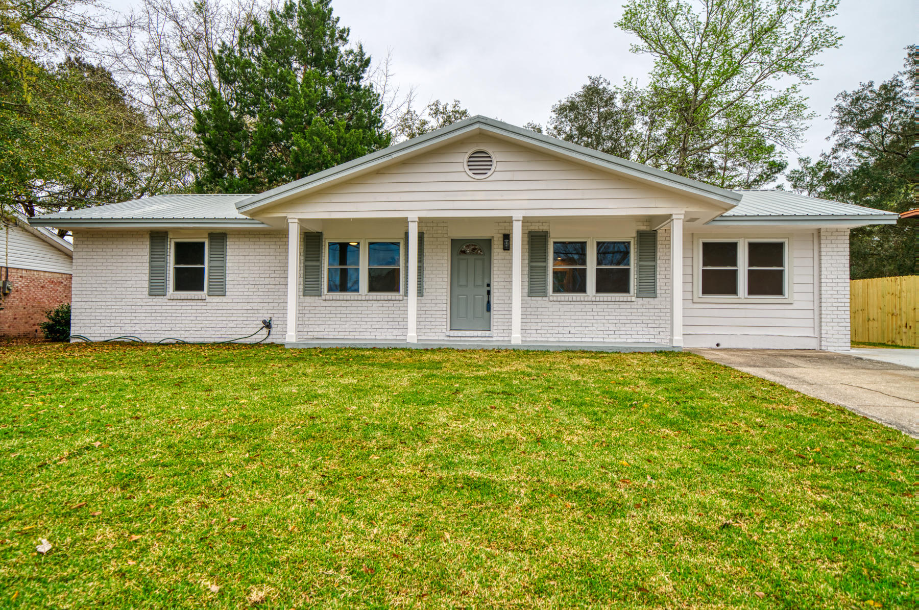 Completely renovated, this roomy home offers 3BR/2BA's with 1962 sqft in the heart of desirable Niceville.The wide open floor plan is perfect for entertaining,boasts a vaulted ceiling & fireplace in the living room area & new wood-like floors throughout the house for carpet-free living.The newer windows in the home make it a light and bright oasis.Kitchen upgrades include professional grade faucet/sink combo, fully tiled backsplash & butcher block countertops to go with the newly vented range, all new appliances & cabinets galore,with extra storage in the new bar area off the kitchen.Both bathrooms are tastefully renovated. This home has all new lighting, ceiling fans, & doors throughout. The metal roof is less than 4 years old. Fenced back yard and only 10 miles from Eglin AFB back gate.