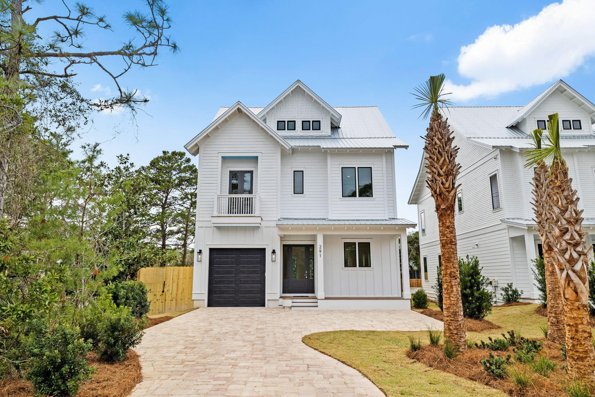 Presenting a spectacular custom-built home nestled in the heart of Seagrove. This prime location is just a short walk to three beach accesses, the vibrant Seaside town center, and all the shopping, dining, and entertainment that 30A has to offer. The home itself is beautifully landscaped and fenced, offering both privacy and curb appeal. With a spacious 3,330 sq ft of living space, this home boasts 5 generously sized bedroom suites, each with its own private ensuite bath. Additionally, a convenient half bath is located on the 1st floor for guests.The thoughtfully designed floor plan seamlessly blends entertainment and family living, ensuring ample space for everyone to enjoy. The gourmet kitchen is a chef's dream, featuring professional Cafe series appliances, including a 6-burner gas range, double dishwashers, and a freestanding ice maker. This culinary haven is perfect for hosting gatherings, whether you're mingling at the island bar or sharing meals around the dining table. The inviting living room overlooks a breathtaking outdoor space that truly feels like a five-star resort. Step onto the covered back porch, lounge by your private pool, and unwind in the soothing spa. The outdoor space also offers an ideal setting for dining alfresco under the stars.