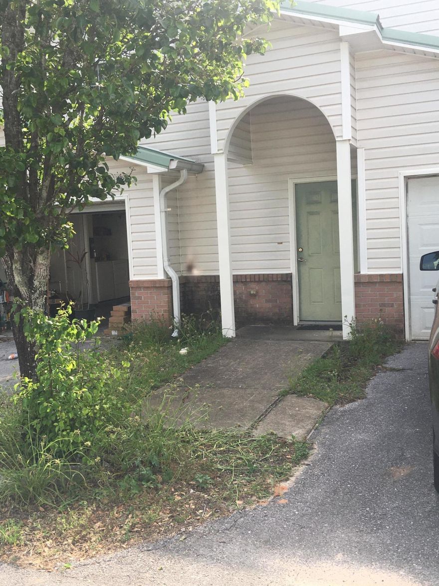 SELLING AS IS - INCLUDING APPLIANCES & WASHER & DRYER. With some work this condo/townhouse style could be a great home or investment property!!! Metal roof, brand new HVAC unit  & duck work!  Substantial amount of drywall needs repaired where it was cut out for new duck work, needs bottom cabinets in kitchen, the countertop is in the garage with the appliances.  Needs flooring through out! This shouldn't unit shouldn't last long!,  Close to bases, shopping, hospital and much more!