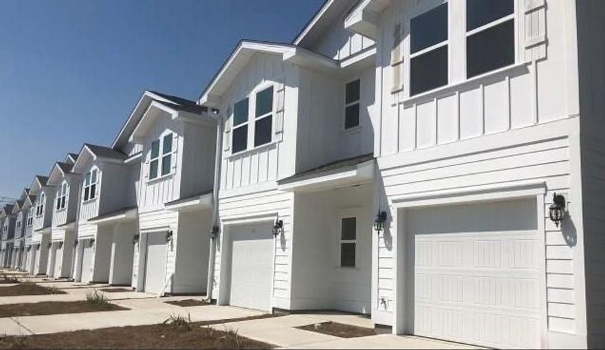 Welcome to Sandhill Pines, a new townhome community.  PRIME location, right off Mack Bayou in Santa Rosa Beach, minutes from Sacred Heart Hospital, Grand Boulevard (which hosts a plethora of shopping and fine dining options), 4 miles to Silver Sands Shopping Center, 3.5 miles to Topsail Hill Preserve State Park and just 5 miles to Dune Allen Beach Access. An ideal primary residence, second home or investment opportunity that will generate considerable rental income.  All  townhomes are 3 bedrooms, 2.5 bathrooms, and just over 1500 ft.² of heated and cooled space, including a one car garage. Community is surrounded by trees, offering tranquility and beautiful scenery.  Other features include a beautiful wooden bridge, street-lights, and a community mailbox station.