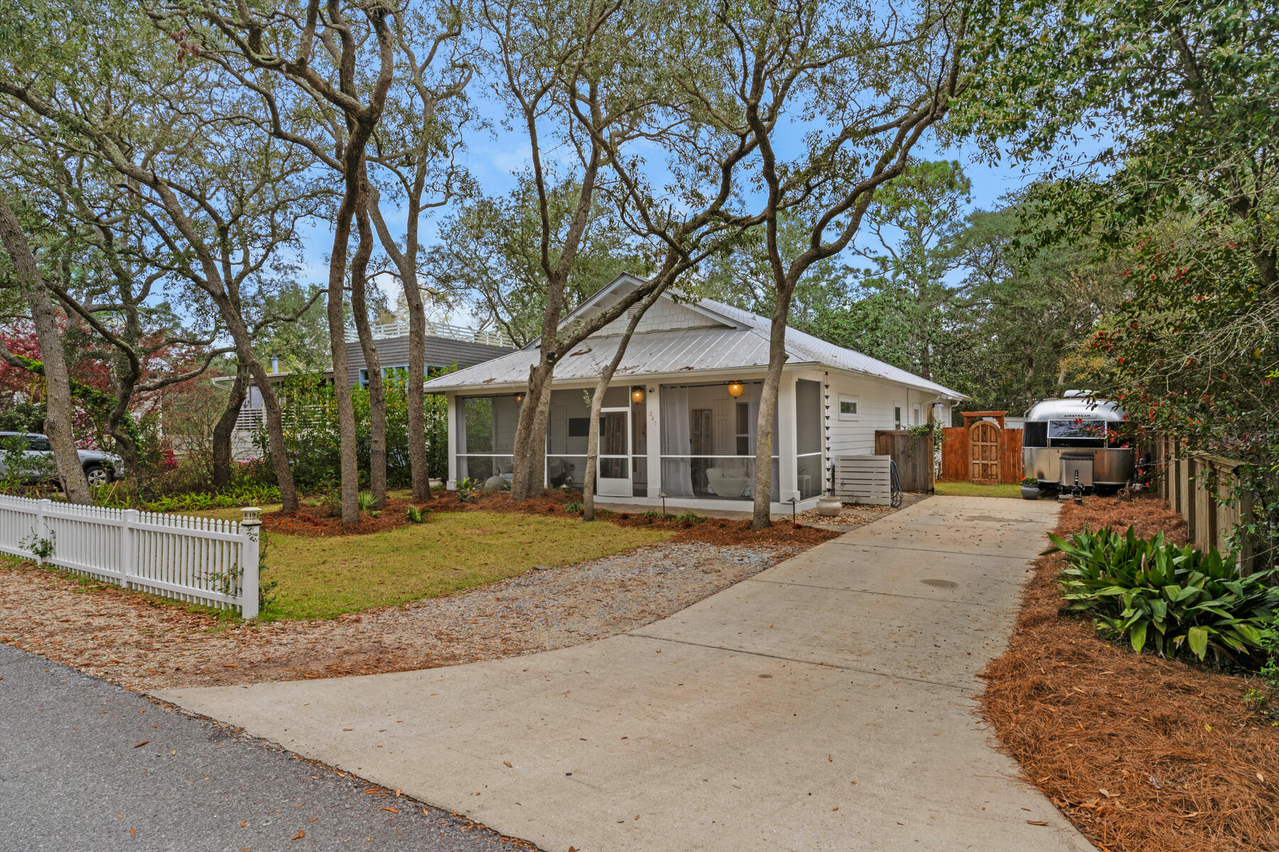 Welcome to your dream coastal retreat! Nestled in a charming beach community, this home boasts an array of desirable features perfect for both personal enjoyment and investment potential. As you approach the property, you'll notice the inviting curb appeal with fresh new paint and a newly sodded lawn framing the sizable yard. The absence of an HOA provides you with the freedom to personalize and utilize the space as you wish, whether it's for relaxation, entertaining, or potential rental income. Step inside, and you'll be greeted by the warmth of natural light cascading through newly installed shiplap walls, creating a cozy yet modern ambiance. The spacious living area seamlessly transitions into the updated kitchen, complete with sleek countertops, stainless steel appliances, and ample