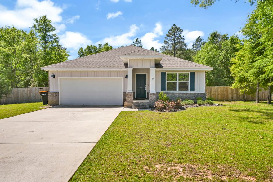Great curb appeal! This well maintained craftsman style home is better than new and has been updated. When you enter the house you are welcomed by a wide hall way that leads back to the open planned living area deigned for entertaining at the back of the house.  Open kitchen features island with breakfast bar, large corner pantry, white cabinets and stainless appliances.  Luxury wood effect vinyl planks flow throughout the home making the floors pet and sand friendly. Ceiling fans and recessed lighting throughout. Off the great room is the large primary suite.  Ensuite bath with double vanities, 5 foot shower and large walk in closet. The 3 additional bedrooms and hall bath are perfectly sized. Indoor laundry room. Brick home for low maintenace. Large yard as a half acre lot. Covered back