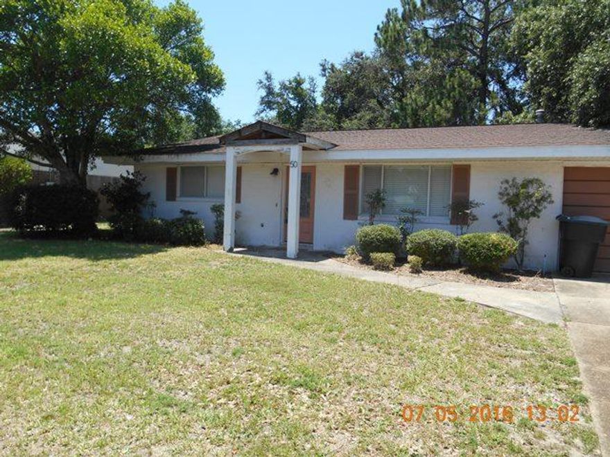 REO ~ Older Home w/ Lots of Potential! This 3 Bd / 2 Ba home offers many updates & has lots of potential for starter home. The living room as well as bedrooms feature wood flooring. The kitchen & dining room have tile through out. The kitchen has been updated with newer cabinets, granite counter tops & stainless range. The master bath has tile shower & updated fixtures. Centrally located in Ft Walton Beach, the home is convenient to both bases & within 15 minutes to the beach!