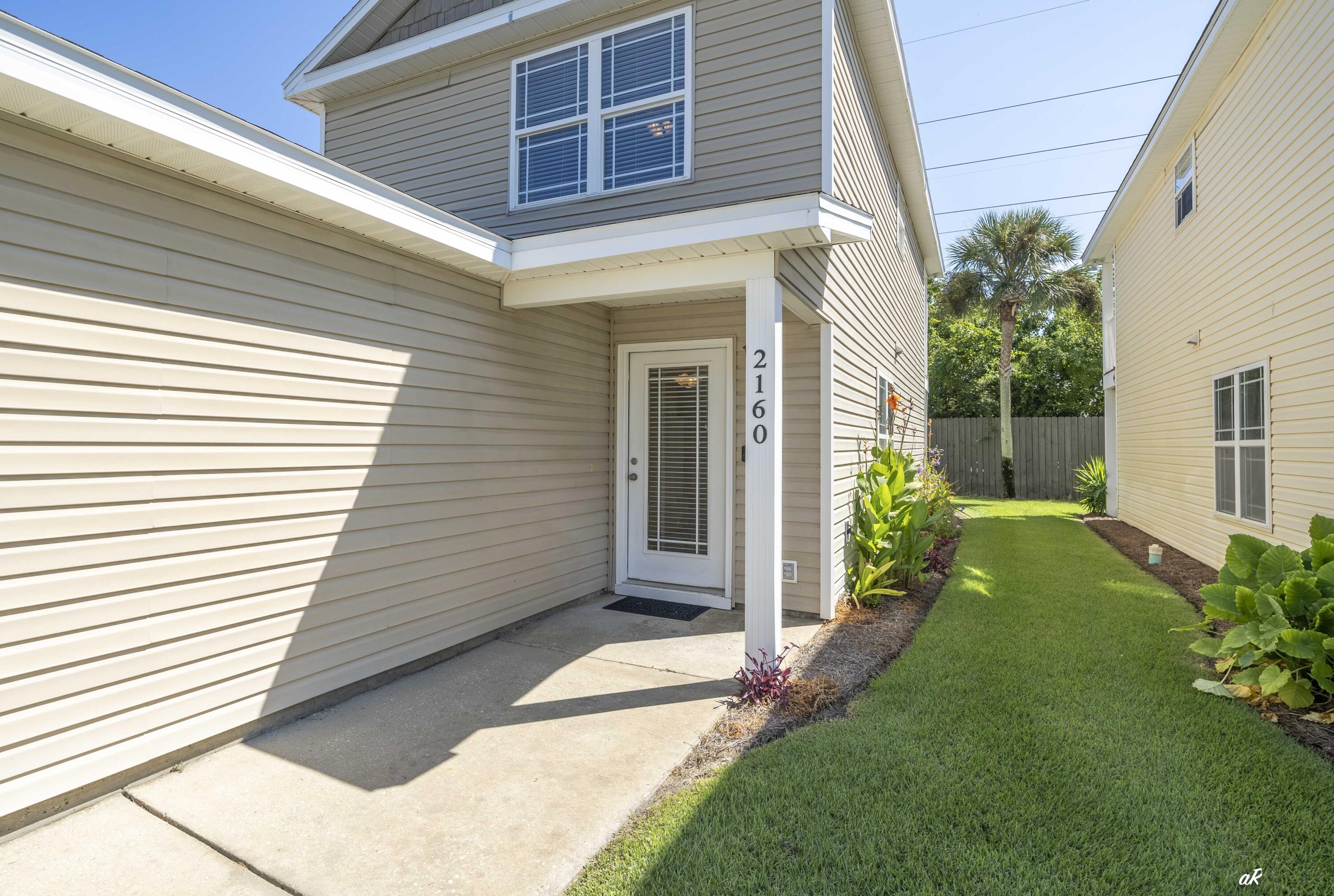 Sterling Cove, a gated community on Panama City Beach where convenience and low-maintenance living meet coastal lifestyle. Residents enjoy a sparkling community pool, quiet private roads, and the freedom of no grass to cut, leaving more time to relax and explore all the area has to offer. This spotless home features an attached garage, tile flooring in the main living areas, updated appliances, and additional storage space. The property can be purchased furnished or unfurnished, giving you flexibility to move right in. Both spacious bedrooms feature private balconies, plus you'll enjoy a covered back porch with no neighbor behind you for added privacy. The HOA covers pool access, lawn maintenance, pest service, and garbage collection. Sterling Cove is perfectly located--minutes to the Navy Panama City proper, and just a short drive to the Gulf of Mexico. Multiple restaurants and shopping options are within walking distance, and the gated entry means you'll never need to fumble for keys. Currently the only unit available in the subdivision, this home offers the perfect blend of comfort, security, and lifestyle in one of the best spots on the beach.