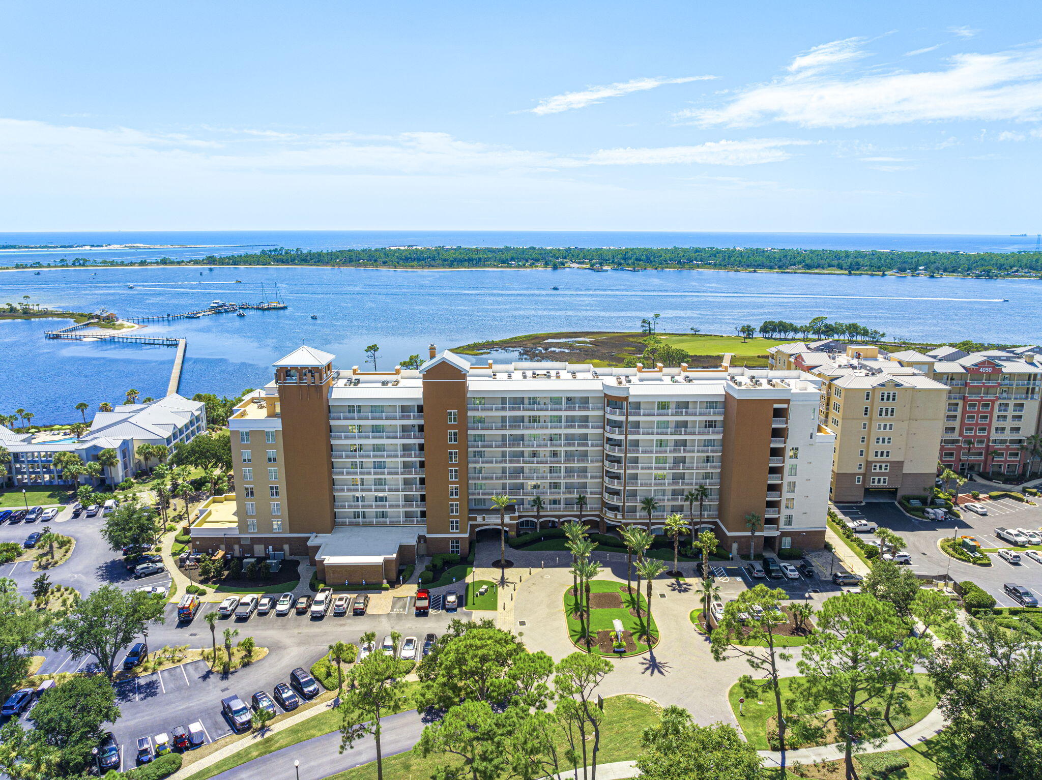 Reflections Spa & Resort at Bay Point is one of the Premier and Luxury condominium resorts in Panama City Beach. This is a wonderful place to live full time, or these units can be short term rented! Refined Coastal living at its finest, between the boats returning from their day at sea, breathtaking sunrises/sunsets, active wildlife such as dolphins and herons, and golfers swinging on the signature fifth hole of the only Nicklaus Course in NW Florida, this condo will check all of the boxes. This immaculate and convenient 1st floor, 2 bedroom/2 full bathroom condo has been tastefully updated to include life proof LVP floors, crown molding, designer remote-control fans with lighting, new baseboards, full condo floor to ceiling paint including trim and doors, custom Ruvati Sink, Kohler Commercial Faucet, Samsung stainless steel appliances- refrigerator has internet access and there are custom shutters throughout. The AC Coils and Hot Water Heater are also less than 3 years old. Over 66k in renovations have been made to create a turnkey, immaculate and stunning unit! Onsite at Reflections, you'll find a 10,000 sqft tropical resort style pool (seasonally heated), hot tub, fire pit, grill station and fitness center and brand-new tennis courts at Aldo where you can get private lessons from one of the tennis pro's onsite! When you get hungry, head next door to the Bluegreen Vacations Bayside Resort, where you'll find 4 great options for food (Cabana Cafe, Flip Flop's, Tides Restaurant and Lounge, and Pelican's). Watersport Rentals, private charters, adventure tours, and Shell Island Shuttles are all available through the Paradise Adventures Kiosk, which is located on the pathway out to the dock. Additionally, Serenity Spa is directly on site at the bottom floor and offers full spa services to owners and guests. Inquire today to discover why Northwest Florida remains one of the most highly sought out areas and start living the coastal lifestyle that you deserve!