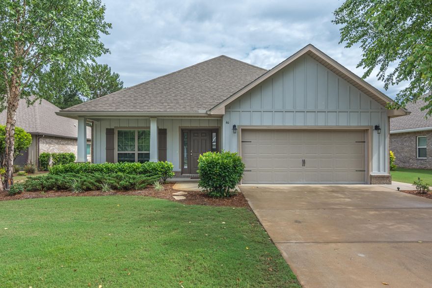 Beautiful craftsman style home with the popular Bailey Floorplan situated on a quiet cul de sac within Passages of Hammock Bay and overlooking Lake Hemingway. Original owners' upgrades make this a special home; arched thresholds, crown molding, trey ceilings, hardwood flooring, granite countertops, recessed lighting, wood cabinets, natural gas convection stove/oven, tumbled stone backsplash, 2'' blinds throughout and much more. Master bedroom features a large walk in closet and en suite bath with a garden tub, a separate walk-in shower and double vanity with beautiful granite countertop. Two guest bedrooms each have walk-in closets providing plenty of extra storage. Beautiful landscaped backyard can be enjoyed from your screened in porch out back and enjoy the wildlife on the Lake.