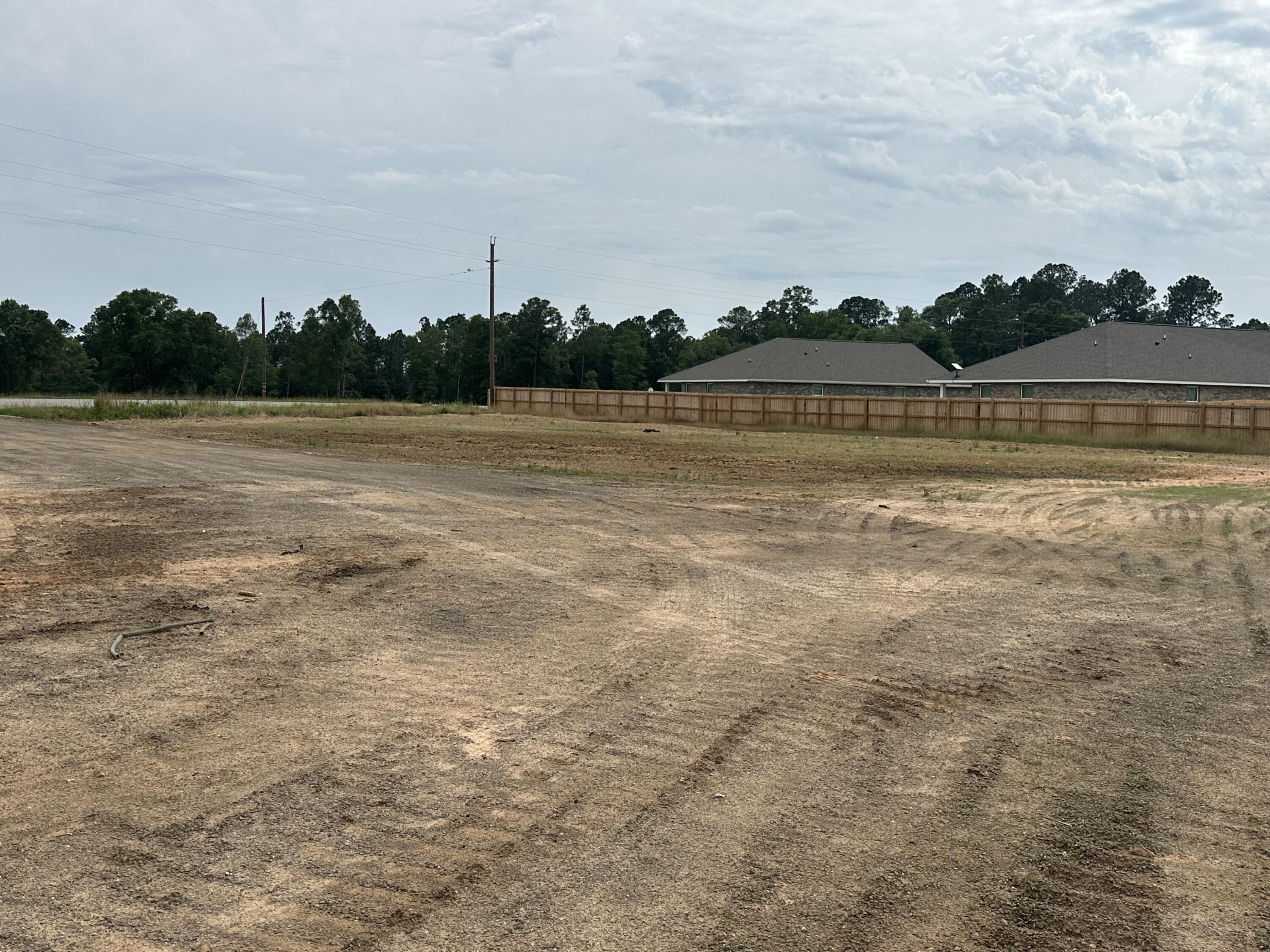 5+/- Acres with Hwy 4 Frontage in BakerThis cleared 5-acre parcel features paved road frontage and direct access to Hwy 4. With the new I-10 connector under construction and Hwy 90 just a short drive away, the location offers strong travel connections throughout the region. Level homesite out front and a Dirt pit in the rear great for dirt bikes or an RC track.