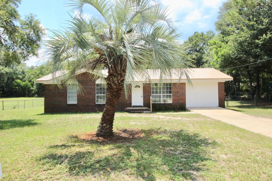 Neat and clean brick 3 bed/2 full bath with potential for 4th bed or use as a den/playroom. Located inside the city limits of DeFuniak Springs, convenient to schools, parks and shopping. Brand new vinyl flooring throughout most of the home - tile elsewhere (so no carpet!). Very large fenced back yard with small storage building. Don't wait to see what could be your new home!