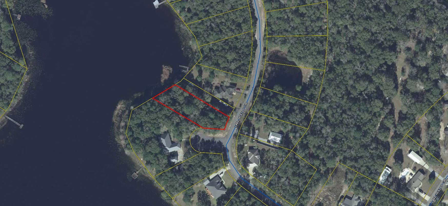 Gorgeous Waterfront Lot on Lake Holley in DeFuniak Springs. Lake Holley is a 400+ acre fishing lake with record size bass, bream and catfish. This exclusive subdivision is home to some of the loveliest large homes in north Walton County. Lot is located on a paved street, electricity is available. Lot requires a well and septic tank. Excellent building lot. Restrictions and plat are attached under document tab above.