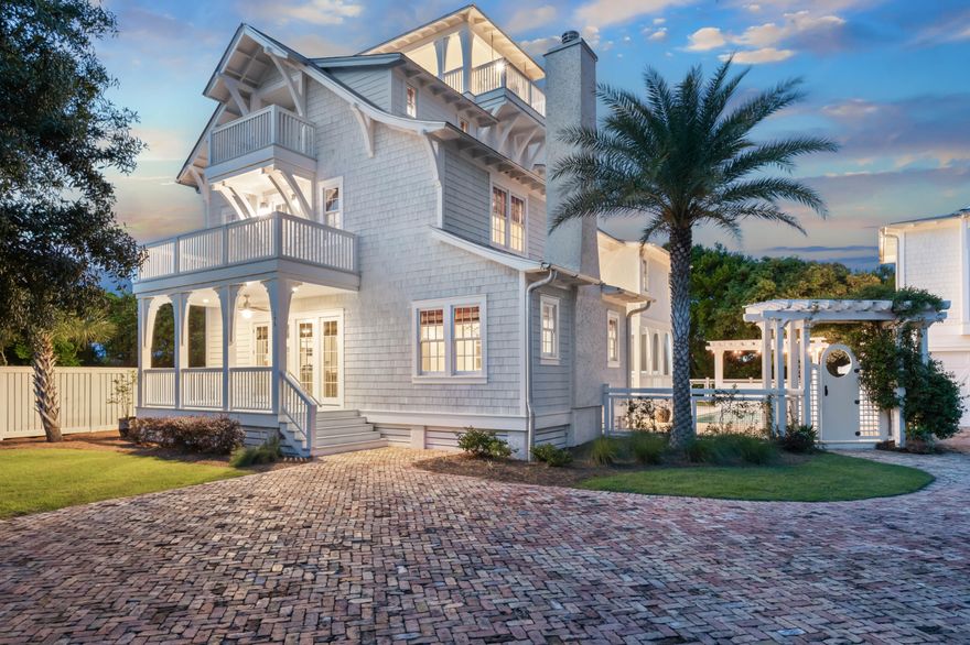 Inlet Beach's most private home embodies sophistication, timeless luxury, and unparalleled coastal living. Featuring expansive living areas ideal for grand-scale entertaining and intimate private spaces conducive to relaxed conversations, the thoughtful floor plan effortlessly flows from elegant room to room and seamlessly integrates with private outdoor spaces. Meticulously designed with a garden terrace to the east and a charming central courtyard, this residence bathes in abundant natural light, a rarity in Inlet Beach homes. Upon entering the foyer, one is immediately struck by the generous volume and luminosity. The wide, spectacular gallery spans the floor from east to west, offering a sense of the first floor's vastness. This magnificent 7-bedroom, 8.5-bathroom residence exudes privacy and comfort. Set on an expansive gated estate, this property guarantees unrivaled seclusion and sophistication. Boasting a guest house, a 2-car garage, and beach access merely a block away, this is the pinnacle of coastal living. 

The main house reveals a pool with an adjacent outdoor bath for ultimate convenience and relaxation. Newly added outdoor kitchen promises a culinary experience of unparalleled refinement. This legacy home emanates allure while preserving its rich character, highlighted by 10-inch-wide rough-sawn heart pine floors sourced from a historic Kentucky barn constructed in 1860. The charm of the kitchen and living areas is further enhanced by the addition of the oyster shell chimney and fireplace, complementing the stunning Pecky cypress ceilings.

Step into a fully furnished interior adorned with luxurious amenities reflecting meticulous design. The kitchen features a Wolf range, complemented by high-end Wolf and Sub-Zero Pro Series appliances, including a 48" range, refrigerator, dual dishwashers, an ice machine, and a wine refrigerator. Calcutta marble graces the kitchen and two primary suites, while Cararra marble adorns all other baths and wet areas, adding a touch of elegance. Custom cabinetry, crafted by Matt Fuller of Kay Fuller and Sons in Albany, GA, features inset doors and beaded face frames, elevating the home's aesthetic.

All bedrooms feature en-suite baths, and the property boasts three separate laundry areas and seven outdoor porches offering breathtaking Gulf views. The first floor primary suite is a sanctuary, featuring a soaking tub, dual vanity, walk-in closet, and two accesses to private porches. Immerse yourself in tranquility while enjoying stunning ocean vistas.

A sophisticated sound system throughout the home and pool area complements the reclaimed beams that grace the interiors. The real wood cedar shake exterior, combined with Hardy plank, completes the home's exquisite design. Unique touches include an elevator for seamless floor-to-floor access, a bunk nook, and a rooftop deck adorned with relaxing bed swings and a stunning 180 degree Gulf view, enhancing the property's charm. 

Beyond the main house, the carriage house offers additional luxury with a king bed, a full-size kitchen, living area, and its own washer and dryer - perfect for guests or extended family. Seamlessly blending comfort, style, and functionality, this home is secured by a private gate, ensuring your peace of mind. Don't miss the chance to experience the epitome of coastal luxury at this Inlet Beach estate