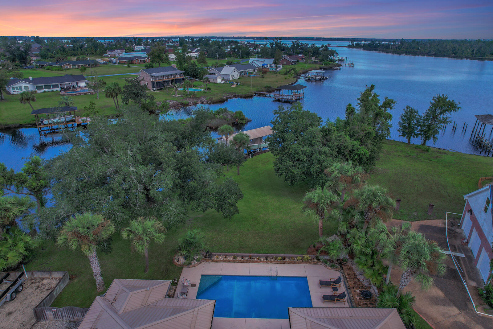 Florida Living at it's finest! This beautifully renovated home is seated on more than 3/4 acre of pristine waterfront property in College Point. Over 150ft of waterfront with gulf access, large canal, boat lift, inground pool, NO HOA and a beautifully renovated interior! This home boasts 5 bedrooms, 2 bathrooms, formal and informal dining areas, an open floor plan and gorgeous water views throughout. Step outside the large back door to a covered entertainment area overlooking the pool, gorgeous oak tree and beautiful bay front. Off the canal you will find a large boat lift with boat house and room for additional jet skis, kayaks and other outdoor toys. This property really has it all! Call your Realtor today to schedule a private tour.