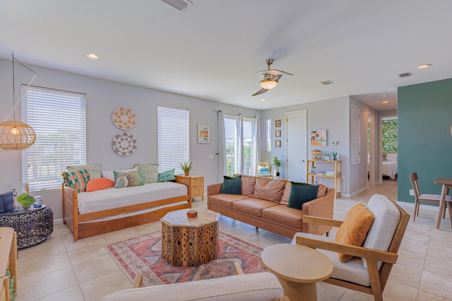 Discover the charm of this elevated 2-bedroom, 2-bathroom home nestled near the vibrant heart of Pensacola Beach. Just steps away from shopping, dining, and entertainment, you'll enjoy the ultimate convenience with no need to drive. This home boasts easy access to both the sound and the gulf, with a public easement to the sound on the west side and a gulf sidewalk easement directly across the street. Picture yourself savoring breathtaking sunrises and sunsets from the decks, and enjoying front-row views of the Blue Angels annual air show. Built for durability and style, the exterior features an added touch of hardiplank and decorative metal siding, complemented by a sturdy metal roof. Impact windows and hurricane covers for the sliding doors provide peace of mind during storm season. The spacious open-concept living, dining, and kitchen area is perfect for entertaining, with seamless flow to front and back decks. The modern kitchen shines with stainless steel appliances, granite countertops, a glass tile backsplash, and elegant pendant lighting. Neutral light tile flooring extends throughout the home, creating a bright and cohesive look. Both bedrooms offer convenient access to bathrooms, and a laundry room is strategically placed near the back deck. Downstairs, storage area provides ample space for your belongings, while the covered parking comfortably accommodates four cars in tandem, with additional driveway space for an RV or boat. Experience the best of coastal living on Pensacola Beach!