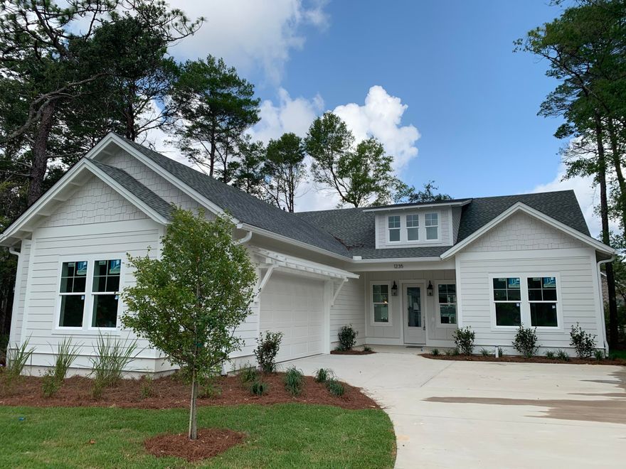 Deer Moss Creek new construction, completed July 2020, beautifully staged for the Parade of Homes. Construction features include 2x6 construction, R19 insulation, impact glass windows, spray foam insulation in attic, upgraded media wiring, architectural detail upgrades, and covered front and back porches. Interior features include LVP flooring, white shaker cabinetry, stainless appliances, nickel plumbing fixtures. The beautiful master bathroom has a separate shower with a free standing bathtub, double vanity sinks and more. Also, you'll love the Aprilaire Fresh Air HVAC System and dehumidifier. Deer Moss Creek is a mixed-use community with plans to include single family, multi-family, commercial, a town center and an office park. Don't miss your chance to get in on Phase One.