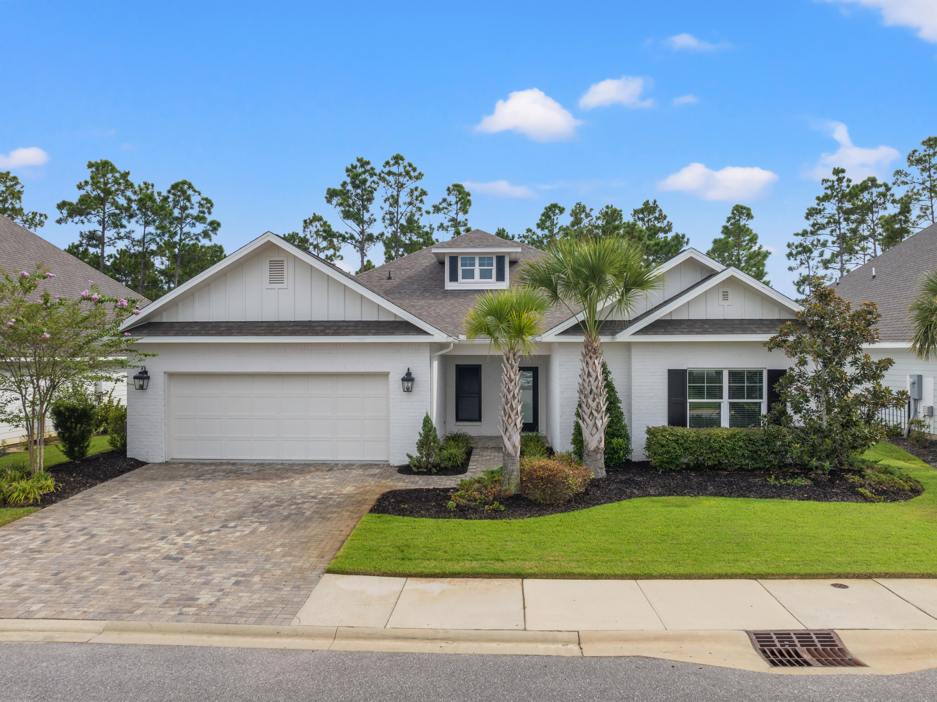 Experience the allure of this pristine brick ranch-style home, ideally located just a mile from the breathtaking beaches of South Walton and the lively 30A corridor. This 4-bedroom gem boasts an expansive 2-car garage and a spacious back porch, designed for seamless entertaining. The outdoor area is a standout feature, offering a summer kitchen, TV, and ample space to enjoy the peaceful surroundings.Nestled in a rental-restricted community, this well-maintained home promises tranquility while being just a short golf cart or bike ride to some of the area's best spots, including Topsail Hill Preserve, Gulf Place, and Blue Mountain Beach. Golf enthusiasts will also appreciate the proximity to Santa Rosa Golf Course, which is less than half a mile away.The community itself is a sanctuary, featuring a secure brick-gated entrance, a refreshing pool, and picturesque walking and jogging trails. Residents can also unwind by the beautifully landscaped 4-acre lake, perfect for fishing or simply soaking in the serene environment. Whether you're looking for a primary residence or a second home, this property offers an unmatched lifestyle in a truly desirable location.
