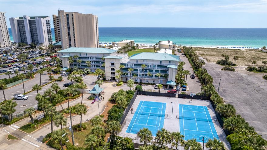This ground floor east corner unit at Silver Dunes is a sweet little paradise. The bedroom is just inside the entrance with the full bath accessible from the hall. The kitchen, dining, and main living areas flow out through glass sliders to a covered patio where you can soak in the amazing sunsets, sea breeze, and take a few steps to relax by the pool and hot tub area. The quiet and gated community of Silver Dunes has much to offer including: stunning beachfront, pool, tennis court, grilling and picnic area, game room, laundry facility, shuffle board, grass courtyard, lush landscaping, and more. Located in the heart of Destin, you're just minutes from family-friendly activities and entertainment such as The Track, Big Kahunas, and HarborWalk Village along Destin Harbor. Simply paradise.