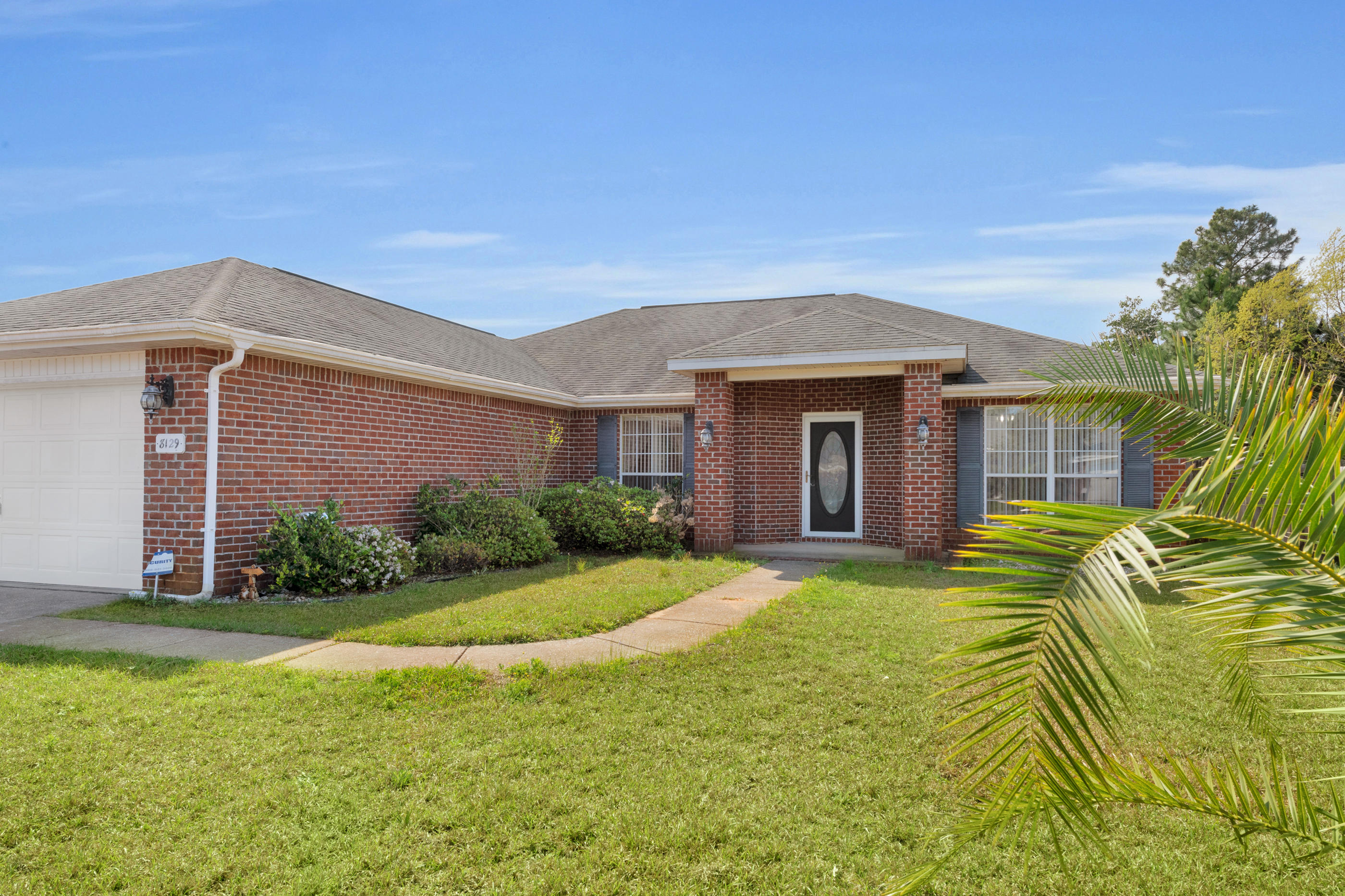 Beautiful, all brick home with large back yard for possible swimming pool. Large wood deck to have back yard party. 5 minutes to the beach, Wal Mart, YMCA, HWY 98, and 15 minutes away from Hurlburt field. Entering the living room, brand new luxuary vinyl plank flooring invites abundant natural light throughout the whole house. Stainless Kitchen appliances, split floor plan, separate laundry room, clean 2 car garage and a fenced back yard for animal lovers. Spacious greatroom.