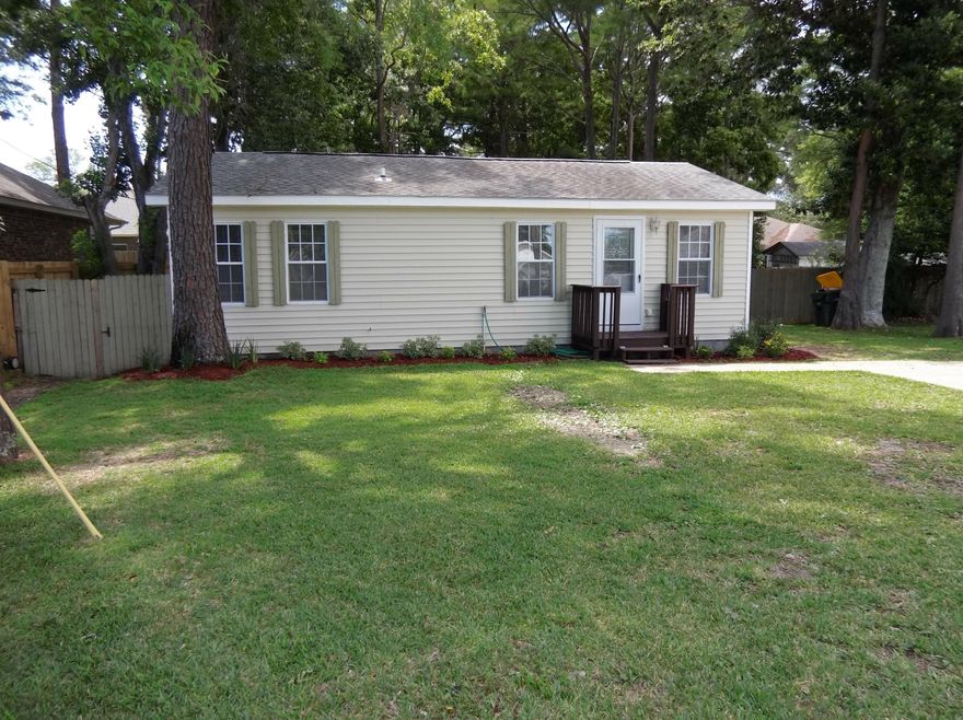 This wonderful cottage style home sits on a spacious lot convenient to Mary Esther. Fresh paint, updated appliances including a refrigerator. Wood style floors.