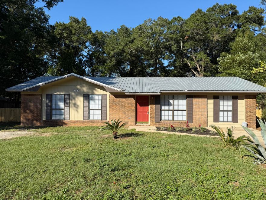 3 bedroom 1 bath with a bonus room is a must see.  Newly painted inside and outside.  Nice size living area as you walk in the door, which is open to the dining area.  Kitchen come with new stainless refrigerator and stainless steel glass top stove.   All three bedrooms are located on the left side of the home.  The bonus room is large enough for an office, play room for the kids, even large enough for a pool table.  Your choice.  Small outbuilding in the back yard.