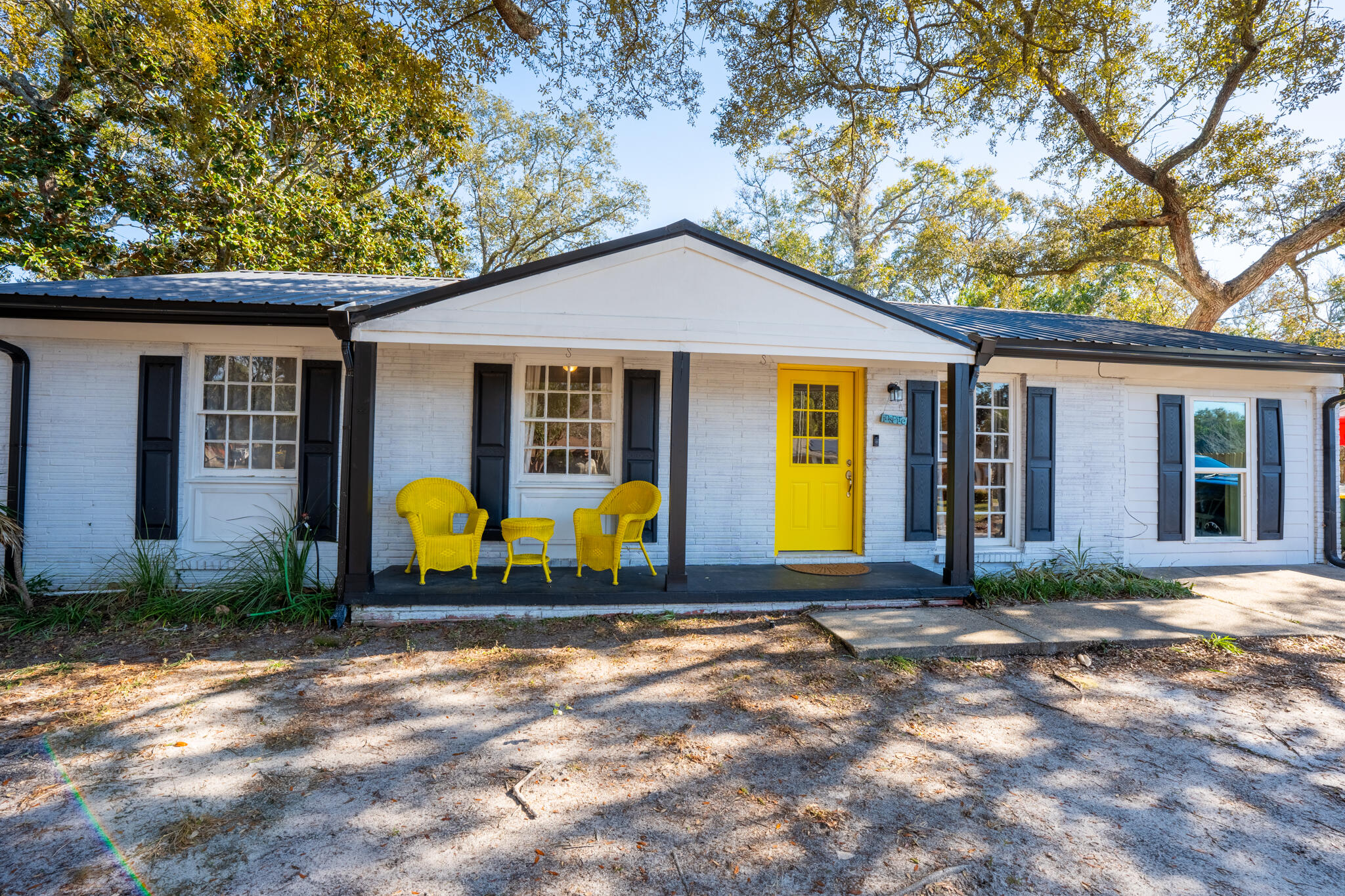 Charming and fully renovated, this 3-bedroom, 1.5-bathroom home is in the heart of Fort Walton Beach. Featuring a modern metal roof and stylish updates throughout, this home boasts a beautifully redesigned kitchen with shaker-style cabinets, sleek granite countertops, and a contemporary subway tile backsplash. Luxury vinyl plank flooring flows through the bright and inviting spaces complemented by updated lighting. The converted garage offers additional living space with a dedicated laundry area. Step outside to enjoy the spacious, covered back deck--ideal for outdoor gatherings--overlooking a generous 1/4-acre lot.This move-in-ready home is just less than a few miles from local schools, shopping, and the beach. Schedule a showing today!