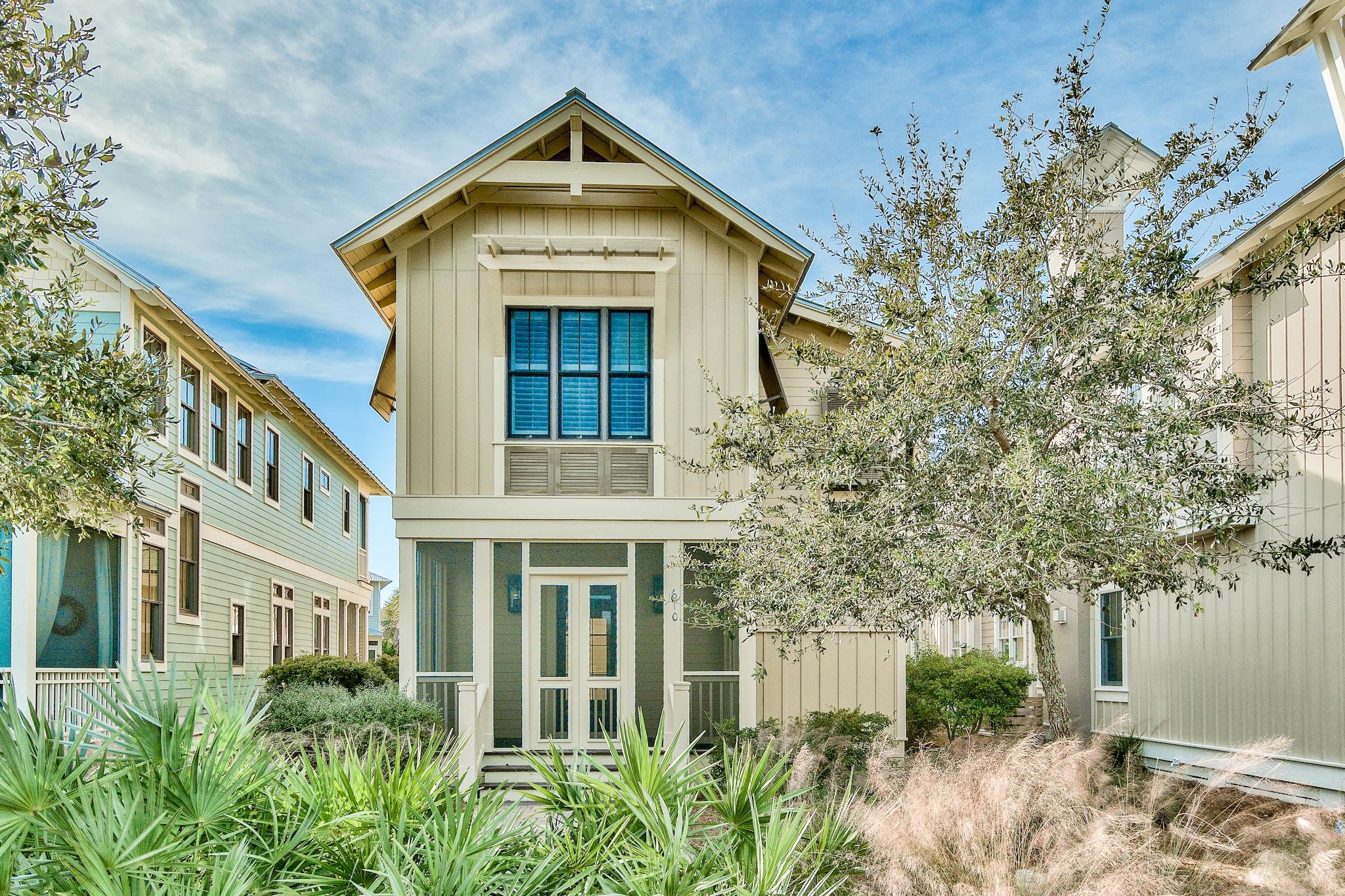 Welcome to this rare find in Naturewalk at Seagrove- a 3 bedroom/3.5 bath main home and a FULL carriage house over a TWO car detached garage. The main house boasts 1,924 square feet and has 3 bedrooms, 3.5 baths. The carriage house is 756 square feet and has one bedroom, one full bath, a living room, spacious kitchen, walk in pantry and laundry room. A spacious deck connects the two buildings making a special place for families to gather for meals, cocktails, and fun. Both houses are tastefully appointed with wood floors, gorgeous cabinetry and sleek granite and marble counters. On the first floor of the main house is a screened front porch where you can enjoy the lake and watch the kids ride bikes right down the street to the pools.