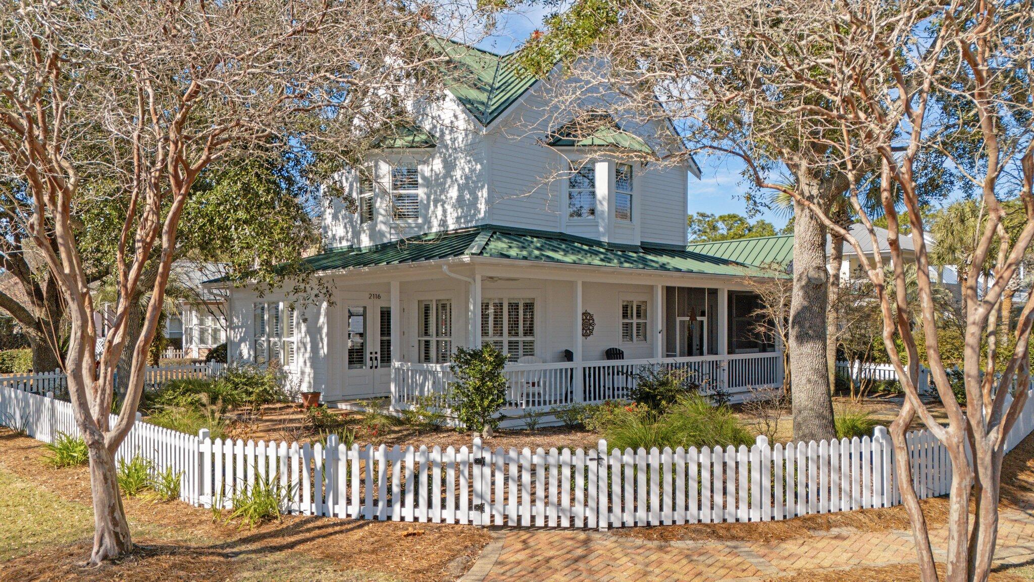 Incredibly Charming! This immaculate 3 bedroom, 3.5 bath offers an open floorplan throughout, perfect for entertaining or simply unwinding after a long day. The kitchen boasts ample space and is finished with Bosch appliances and gorgeous counter tops. Crown molding, hardwood floors, 10 ft. ceilings, 8 foot doors, plantation shutters,  standing seam metal roof, and refinished Travertine 18''x18'' tile throughout. Not to be overlooked is the huge, temperature controlled, 2 car garage, insulated with epoxy floors, and more storage! Embrace the charm while  relaxing on the wrap around front porch overlooking the beautiful landscaped yard and lush gardens. Upstairs bedrooms feature dormer windows with window seats with storage. Everything you could want in your new home!