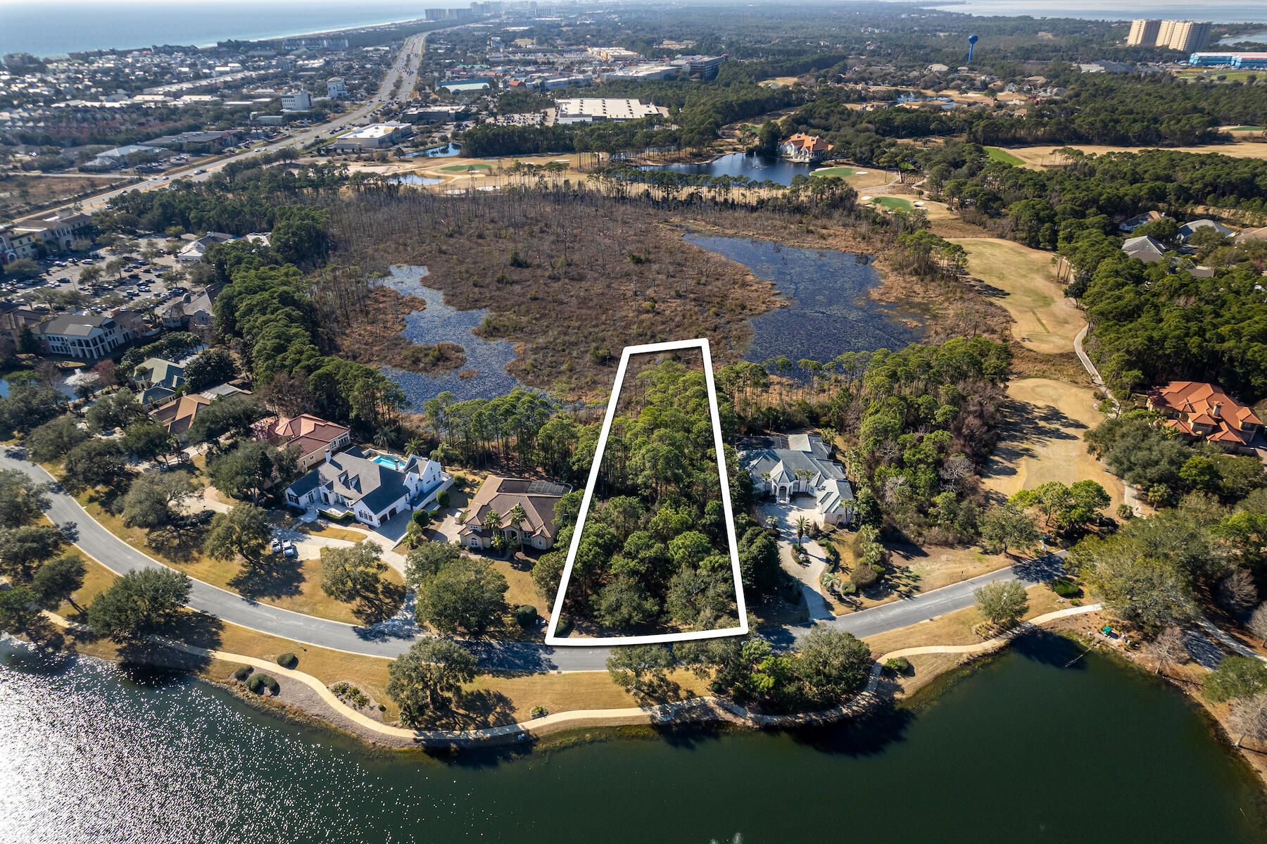 Don't miss the opportunity to build your dream home on this prime estate sized lot located in the desirable gated community of Regatta Bay. With 1.16 acres, there is more than enough buildable square footage to meet the needs of your future residence. This spacious lot is located across from the 8th green of the award-winning Regatta Bay Golf Course and within walking distance to the community pool, pickleball courts, tennis courts, and playground. Enjoy the boating lifestyle at Legendary Marine that can be accessed from the owner's gate on the northeast side of the subdivision. In addition to that, you are a golf cart ride away from Whole Foods, Destin Commons, the Gulf of Mexico and so much more! Take advantage of this well positioned community and all the conveniences it has to offer.