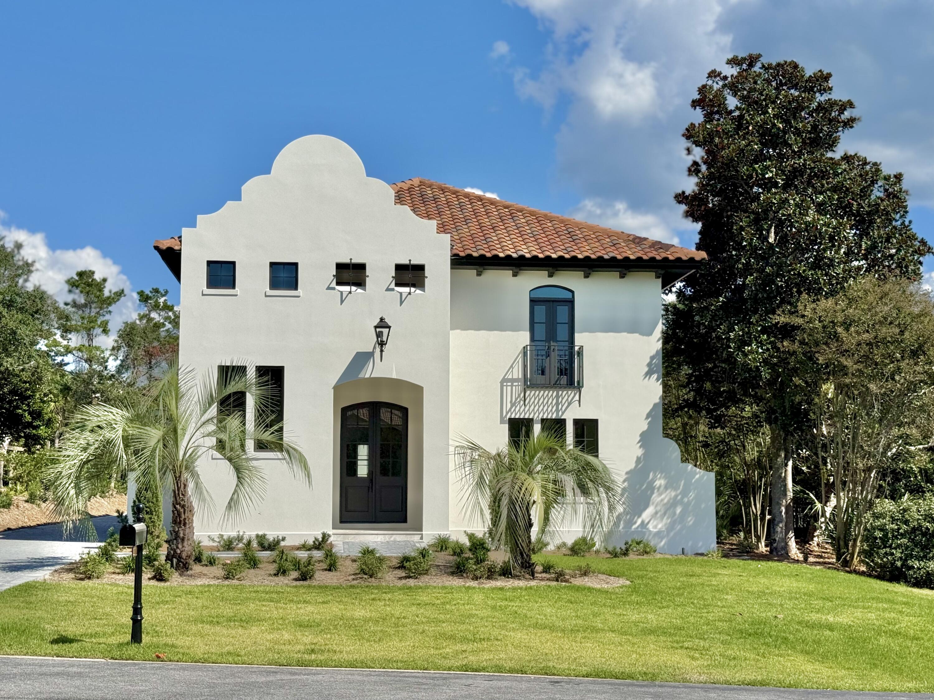 CONSTRUCTION NEARING COMPLETION! More photos to come! So many reasons to love this gem! A one-of-a-kind, luxury residence - nestled securely within the GATED, rental-restricted community of BellaMar at Gulf Place and situated just steps from its DEEDED BEACH ACCESS - offers a golden opportunity to start living your best beach life! Established along a prime stretch of sought-after 30A, BellaMar provides privacy in an ideal location, neighboring Santa Rosa Golf Course, and set across from Santa Rosa Golf and Beach Club. Enjoy an easy stroll to local boutiques and eateries of nearby Gulf Place and an exhilarating bike ride along the pathways to experience all that exciting 30A and the Emerald Coast has to offer. This extraordinary property has undergone a total home makeover and now offers 4,112 sq. ft. of refined living space thoughtfully designed and built by Blue Vista Builders, Inc. Positioned on an expansive .38 acre lot, this exceptional 5 BEDROOM, 5.5 BATH compound incorporates a MAIN HOUSE and a CARRIAGE HOUSE with 2-CAR GARAGE, connected by a lovely, COURTYARD with PRIVATE POOL. High quality details inside and out include: shellstone and wood flooring; rounded-corner walls, windows and doorways; arched entryways; wood beams; custom cabinetry; professional grade, stainless appliances and quartz counters in the kitchen; WALK-IN CLOSETS with built-in storage; FIRST AND SECOND FLOOR LAUNDRY stations; cobblestone pavers; gas lanterns; multiple porches and balconies; and luxury finishes to complement the home.
The MAIN HOME features 4 bedrooms and 4.5 baths, with the MASTER SUITE on the FIRST LEVEL. The inviting front entrance showcases an impressive foyer and stairwell with soaring 21 ft. ceilings, wood beams, a view of the second floor foyer balcony, and windows welcoming natural light. An arched entry leads to an open concept of dining, kitchen, and living spaces to keep gatherings connected. The kitchen promotes a user-friendly workspace with niceties the chef and entertainer will appreciate. It features a large quartz island, Subzero and GE Monogram appliances, custom cabinetry with pull-outs, and built-in hutch complete with wet bar and ice maker. An alluring living room boasts 21 ft. ceilings complemented by wood beams, a view of the second floor loft balcony, a gas fireplace, and French doors which open to a peaceful courtyard and pool with sun shelf feature. A powder room is conveniently located off the kitchen, living and dining area. The spacious master suite has plentiful room for a sitting area, French doors which open to the courtyard/pool, large HIS & HER WALK-IN CLOSETS with built-ins, and built-in laundry station. Tie it up with a well appointed bath highlighting a fabulous soaking tub, oversized shower, and dual separated vanities with custom makeup counter and storage cabinetry.
The second level contains 3 sizable bedrooms, each having their own unique features, ample closets with built-ins, and EN SUITE BATHS with walk-in showers. Additionally, there is an irresistible BONUS/LOFT - suitable for multiple purposes - with balcony overlooking the amazing living room, plus a second built-in laundry station. Upper bedroom #1 features a Juliet balcony offering a postcard view of a well maintained beach community. Upper bedroom #2 includes a built-in wardrobe closet, dressing area, and Hollywood-style bath, accessible two ways: from the bedroom and from the bonus/loft area via pocket doors. Upper bedroom #3 is enhanced by French doors leading to its own covered porch overlooking the courtyard/pool. This generous bedroom also features a sitting area, and could be considered a SECOND MASTER SUITE, with double vanity, walk-in closet, and oversized shower.
The delightful carriage house includes a 2-car garage with storage closet and a third laundry station - for the convenience of beach/pool towels and carriage house guests. Anyone will feel special in the accommodating second floor suite, featuring a bedroom-living room combination, French doors to its own covered porch overlooking the central courtyard/pool, plus kitchenette, full bath with double vanity, and walk-in shower.
With so many desirable features, don't miss your chance to make this rewarding custom home your own!