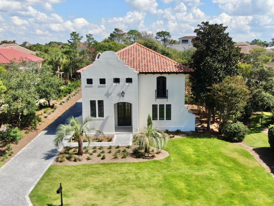 Construction COMPLETE! Available for IMMEDIATE OCCUPANCY! A one-of-a-kind, luxury residence - nestled securely within the GATED, rental-restricted community of BellaMar at Gulf Place and situated just steps from its DEEDED BEACH ACCESS - offers a golden opportunity to start living your best beach life! Established along a prime stretch of sought-after 30A, BellaMar provides privacy in an ideal location, neighboring Santa Rosa Golf Course, and set across from Santa Rosa Golf and Beach Club. Enjoy an easy stroll to local boutiques and eateries of nearby Gulf Place and quick access to the bike pathways along exciting 30A! This extraordinary property has undergone a total home makeover and now offers 4,112 sq. ft. of refined living space thoughtfully designed and built by Blue Vista Builders, Inc. Positioned on an expansive .38 acre lot, this exceptional 5 BEDROOM, 5.5 BATH compound incorporates a MAIN HOUSE and a CARRIAGE HOUSE with 2-CAR GARAGE, connected by a lovely, COURTYARD with PRIVATE POOL. High quality details inside and out include: shellstone and wood flooring; rounded-corner walls, windows and doorways; arched entryways; wood beams; custom cabinetry; professional grade, stainless appliances and quartz counters in the kitchen; WALK-IN CLOSETS with built-in storage; FIRST AND SECOND FLOOR LAUNDRY stations; cobblestone pavers; gas lanterns; multiple porches and balconies; and luxury finishes to complement the home.
The MAIN HOME features 4 bedrooms and 4.5 baths, with the MASTER SUITE on the FIRST LEVEL. The inviting front entrance showcases an impressive foyer and stairwell with soaring 21 ft. ceilings, wood beams, a view of the second floor foyer balcony, and windows welcoming natural light. An arched entry leads to an open concept of dining, kitchen, and living spaces to keep gatherings connected. The kitchen promotes a user-friendly workspace with niceties the chef and entertainer will appreciate. It features a large quartz island, Subzero and GE Monogram appliances, custom cabinetry with pull-outs, and built-in hutch complete with wet bar and ice maker. An alluring living room boasts 21 ft. ceilings complemented by wood beams, a view of the second floor loft balcony, a gas fireplace, and French doors which open to a peaceful courtyard and pool with sun shelf feature. A powder room is conveniently located off the kitchen, living and dining area. The spacious master suite has plentiful room for a sitting area, French doors which open to the courtyard/pool, large HIS & HER WALK-IN CLOSETS with built-ins, and built-in laundry station. Tie it up with a well appointed bath highlighting a fabulous soaking tub, oversized shower, and dual separated vanities with custom makeup counter and storage cabinetry.
The second level contains 3 sizable bedrooms, each having their own unique features, ample closets with built-ins, and EN SUITE BATHS with walk-in showers. Additionally, there is an irresistible BONUS/LOFT - suitable for multiple purposes - with balcony overlooking the amazing living room, plus a second built-in laundry station. Upper bedroom #1 features a Juliet balcony offering a postcard view of a well maintained beach community. Upper bedroom #2 includes a built-in wardrobe closet, dressing area, and Hollywood-style bath, accessible two ways: from the bedroom and from the bonus/loft area via pocket doors. Upper bedroom #3 is enhanced by French doors leading to its own covered porch overlooking the courtyard/pool. This generous bedroom also features a sitting area, and could be considered a SECOND MASTER SUITE, with double vanity, walk-in closet, and oversized shower.
The delightful carriage house includes a 2-car garage with storage closet and a third laundry station - for the convenience of beach/pool towels and carriage house guests. Anyone will feel special in the accommodating second floor suite, featuring a bedroom-living room combination, French doors to its own covered porch overlooking the central courtyard/pool, plus kitchenette, full bath with double vanity, and walk-in shower.
With so many desirable features, don't miss your chance to make this rewarding custom home your own!