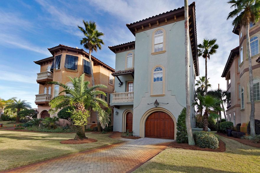 NEW PRICING St. Tropez is a gated community across from the Beach, with a tropical lagoon style pool and DEEDED Beach Access. Go back in time with the Old World Charm of a Mediterranean Tuscan Community featuring cobblestone streets. This 3BR 3.5BA home is immaculate with just over $100,000 in upgrades from the Waterproofing Exterior Paint to the Faux Finishes and Venetian Plaster inside. Rental Projections exceed $65,000. The home features granite, slate, stone and tile throughout. A summer kitchen with gas grill, running water and mini refrigerator has been added for your enjoyment. A brick paver patio and enclosed shower have been added to increase your outside space for dinner, relaxing or coming in from the beach. The first floor features one bedroom, bathroom with glass enclosed shower, garage entry and laundry room. The second floor consists of a kitchen with a breakfast bar, island and half bath.  The kitchen features a Sub-Zero, Dacor Appliances and Gas Cook Top.  The living and dining area both access the covered balcony with slate flooring and Pecky Cypress ceiling.  The third floor features the Master suite with walk in closet, separate shower, Jacuzzi tub and Balcony. A guest bedroom and bath with enclosed glass shower.    The Golf Cart is not available for purchase.   Currently used as a second home with the opportunity to be used as a vacation rental. Rental Projections and Home upgrades are provided in Documents.  This sale is part of a 1031 Exchange.  Furnishings maybe available. Truly a Must See Quality Home!