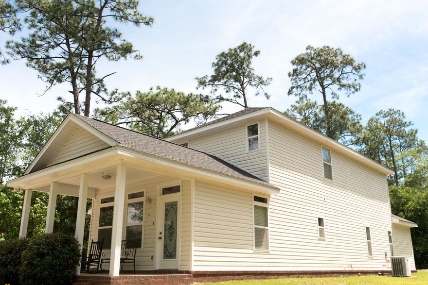 Seclusion with convenience describes this two story cottage style home on a large corner lot with quick access to I-10. Open floor plan with kitchen opening into the living room. The master bedroom with garden tub is on the main level while the additional two bedrooms are on the 2nd floor where they share a full bathroom and sitting room. There is a storage room off the covered patio. The house is in move-in ready condition.